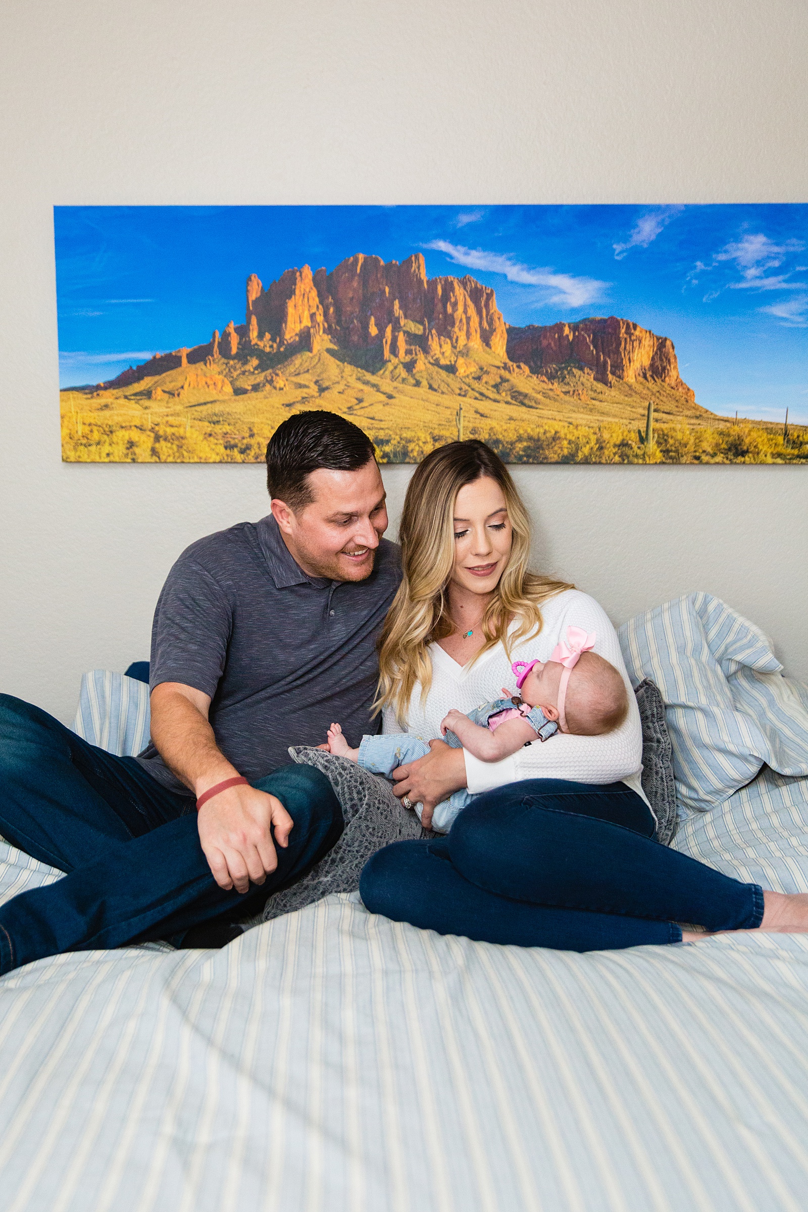 Family look at each other during their Phoenix family session by Arizona family photographer PMA Photography.