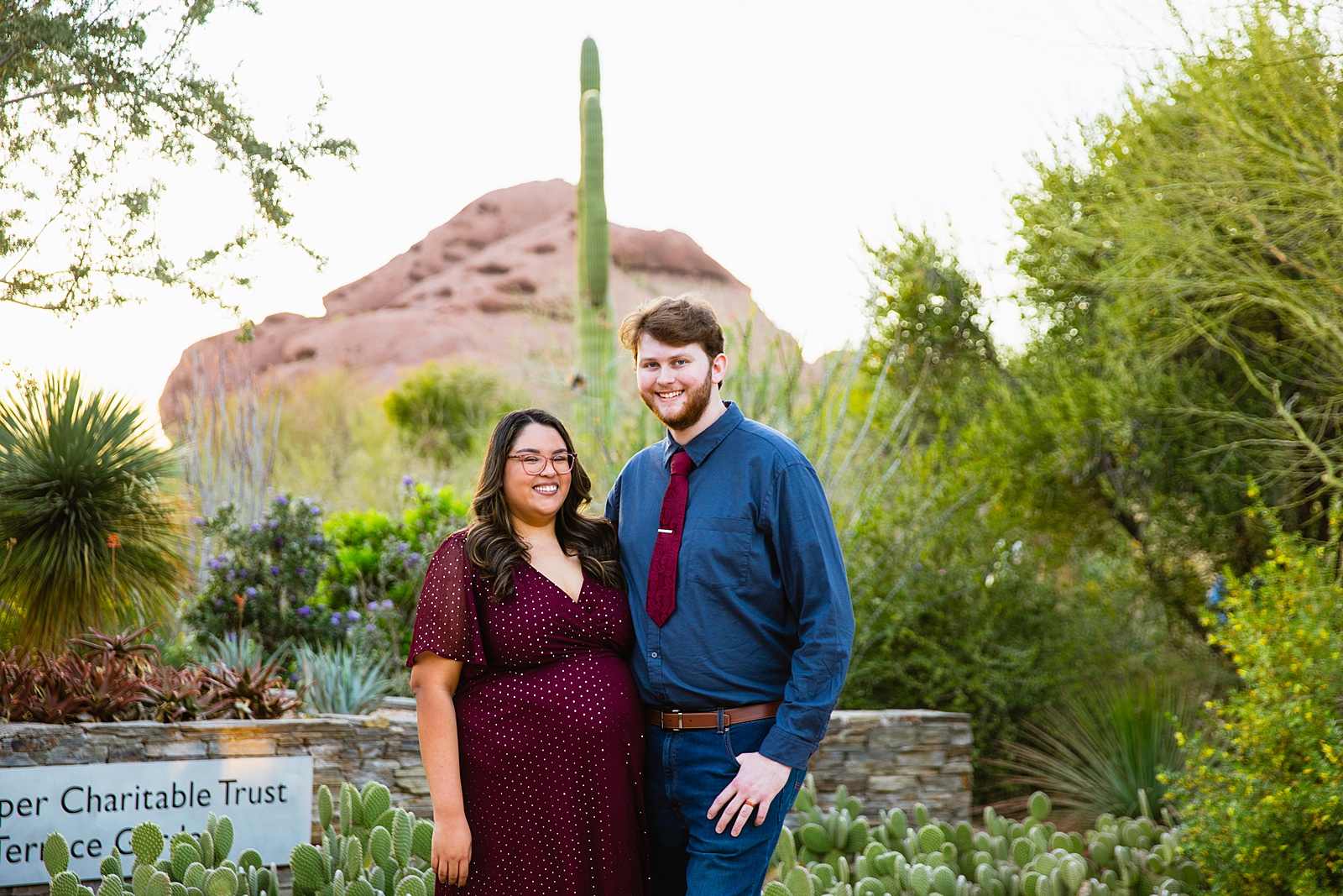 Couple pose for their Desert Botanical Gardens engagement session by Phoenix wedding photographer PMA Photography.
