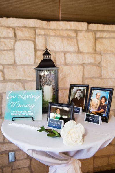 In loving memory table at a wedding reception at Ocotillo Oasis by Phoenix wedding photographer PMA Photography.