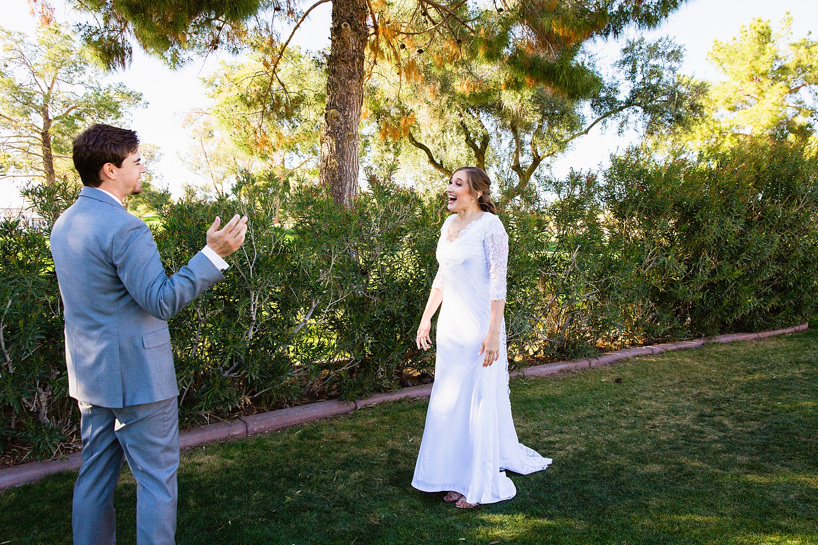 Bride and groom's first look at Ocotillo Oasis by Phoenix wedding photographer PMA Photography.