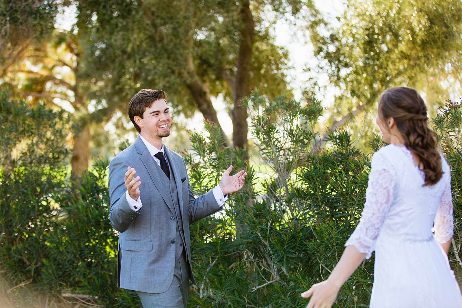 Bride and groom's first look at Ocotillo Oasis by Phoenix wedding photographer PMA Photography.