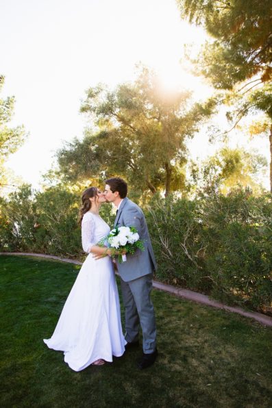 Bride and groom share a kiss during their Ocotillo Oasis wedding by Phoenix wedding photographer PMA Photography.