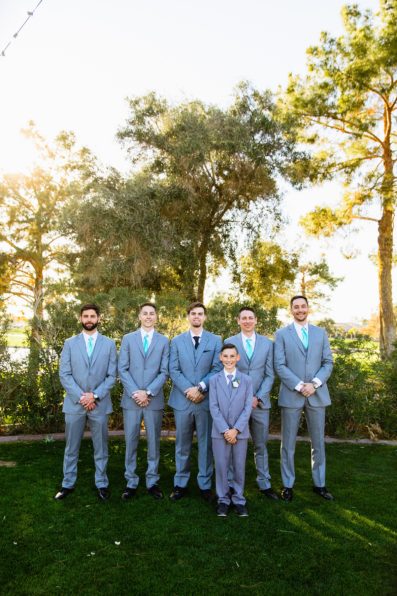 Groom and groomsmen together at a Ocotillo Oasis wedding by Arizona wedding photographer PMA Photography.