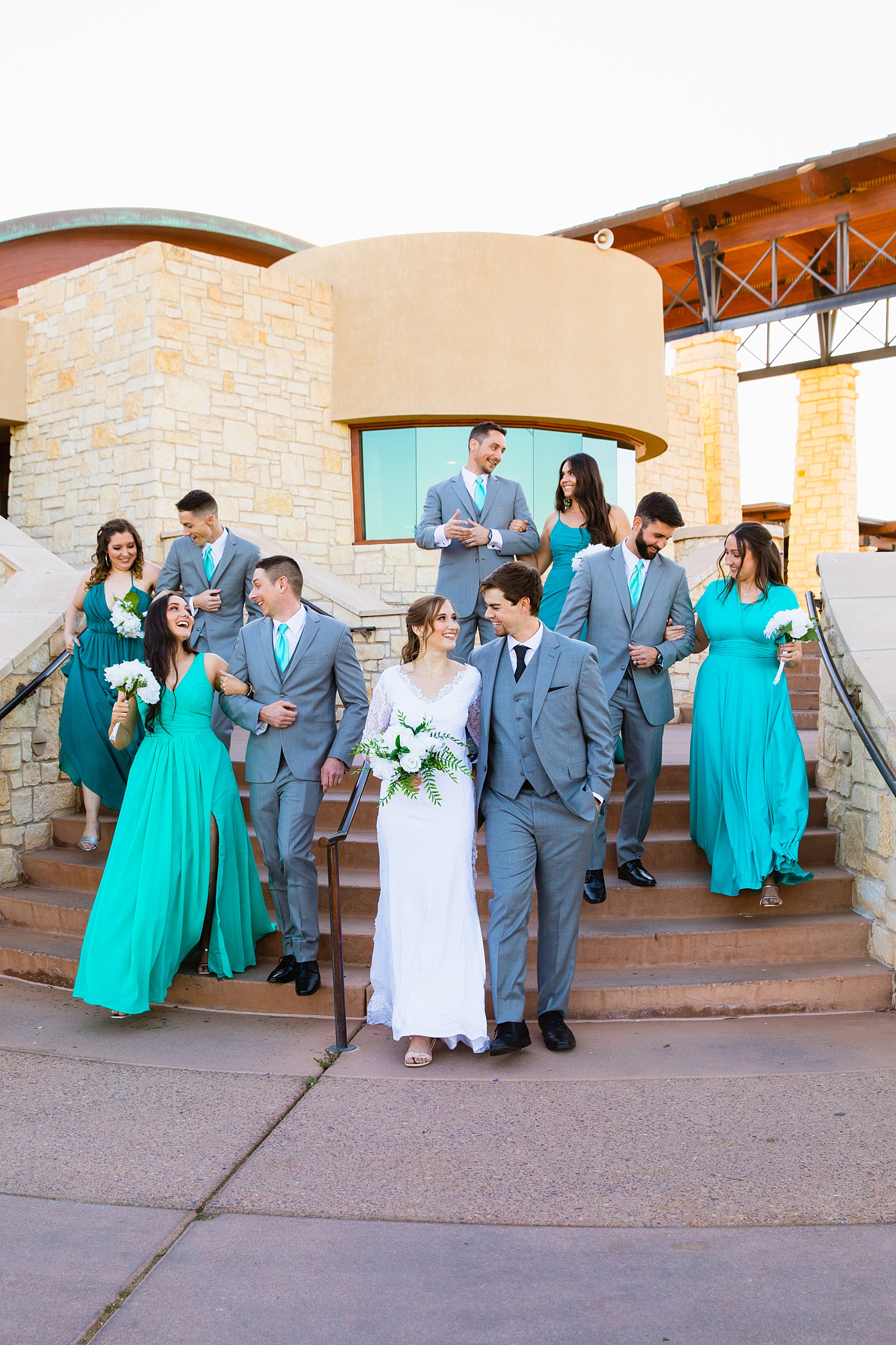 Bridal party laughing together at Ocotillo Oasis wedding by Phoenix wedding photographer PMA Photography.