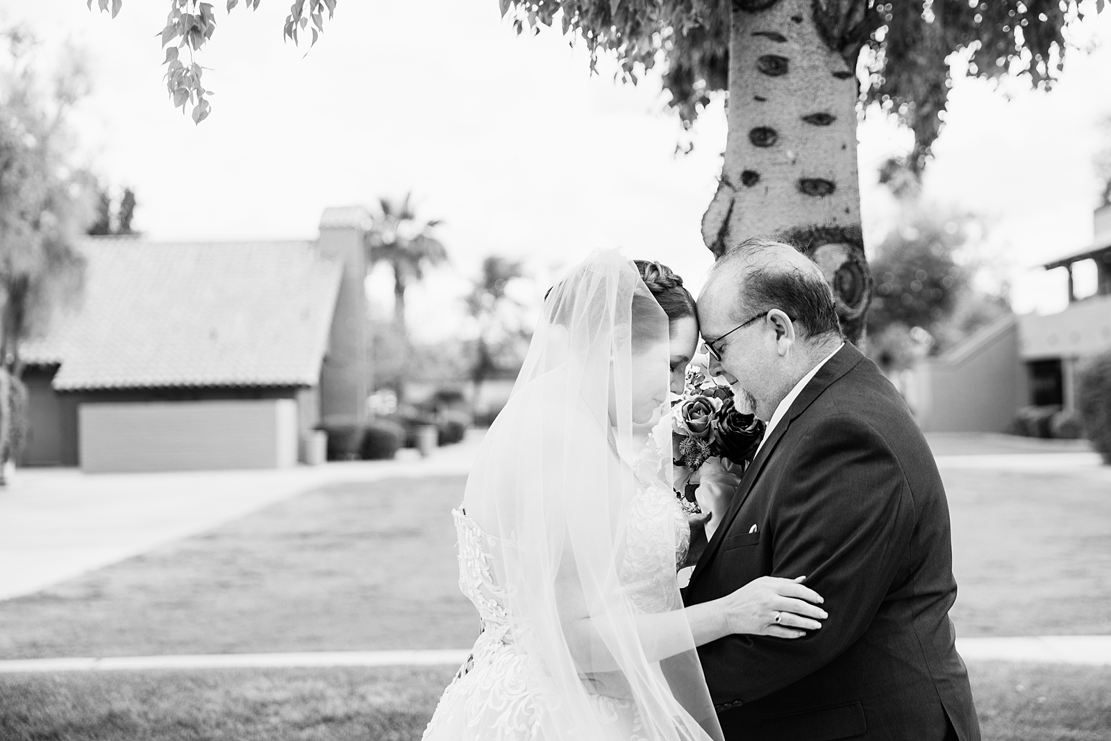 Newlyweds share an intimate moment during their first look at Sun Valley Church by Phoenix wedding photographer PMA Photography.