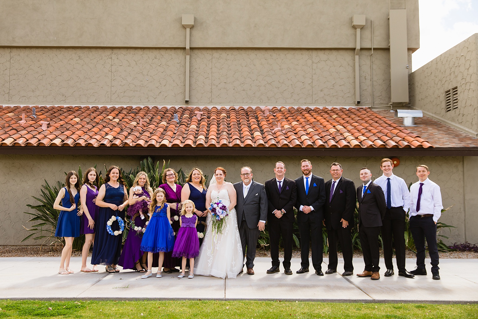 Bridal party together at a Sun Valley Church wedding by Arizona wedding photographer PMA Photography.