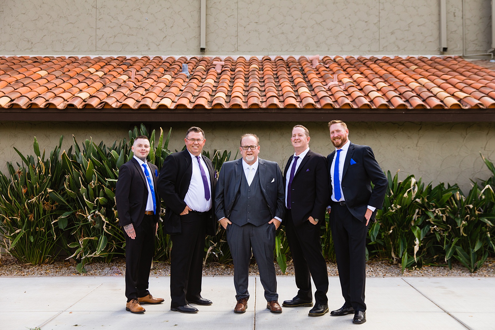 Groom and groomsmen together at a Sun Valley Church wedding by Arizona wedding photographer PMA Photography.