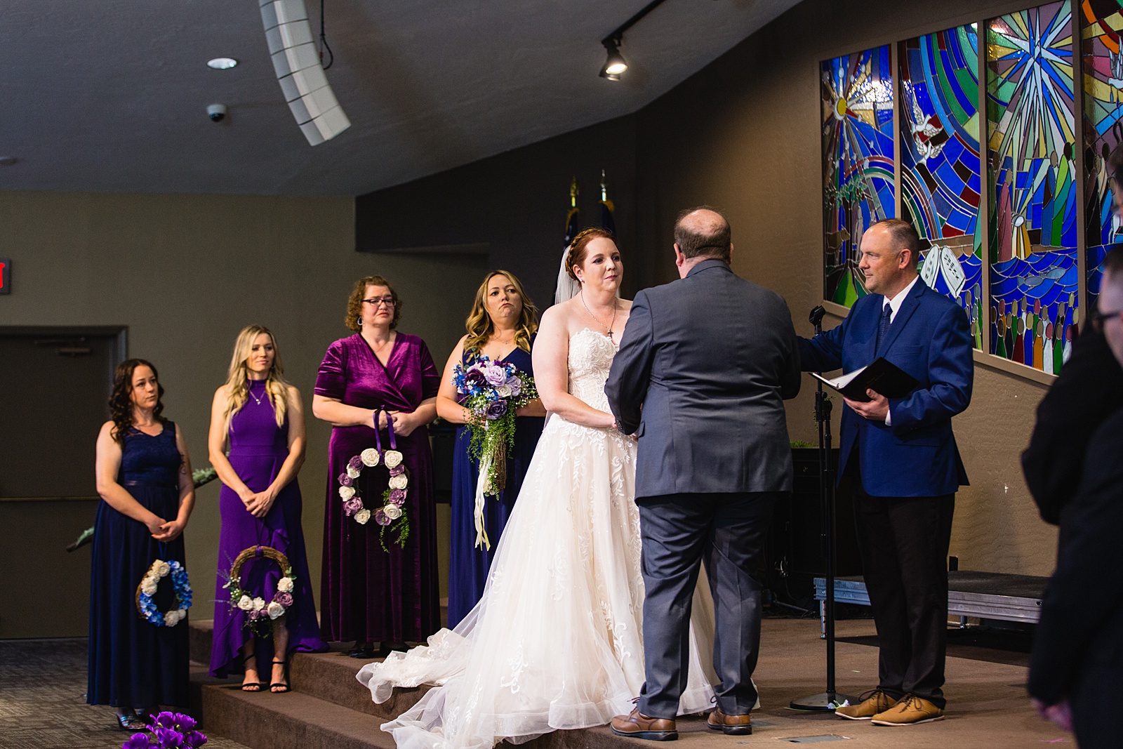 Bride looking at her groom during their wedding ceremony at Sun Valley Church by Tempe wedding photographer PMA Photography.
