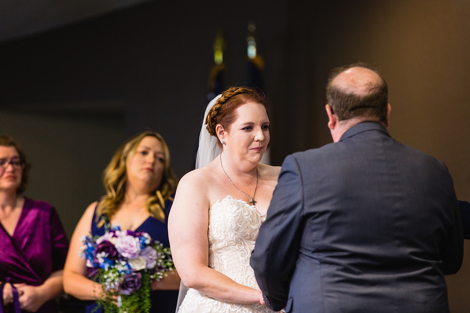Bride looking at her groom during their wedding ceremony at Sun Valley Church by Tempe wedding photographer PMA Photography.