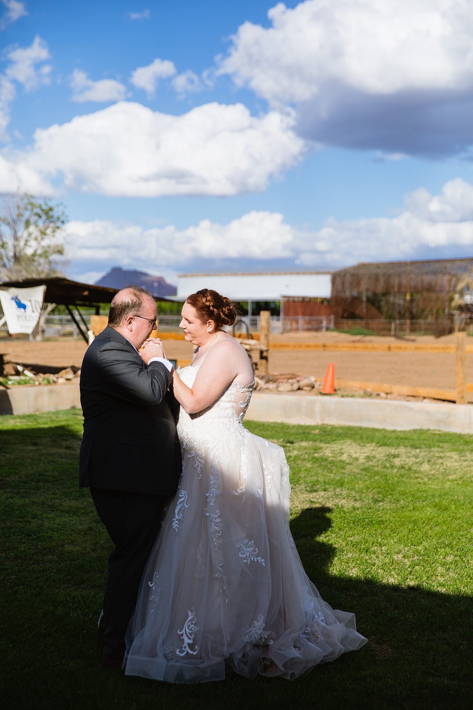 Newlyweds sharing first dance at their 101 Polo Club wedding reception by Arizona wedding photographer PMA Photography.