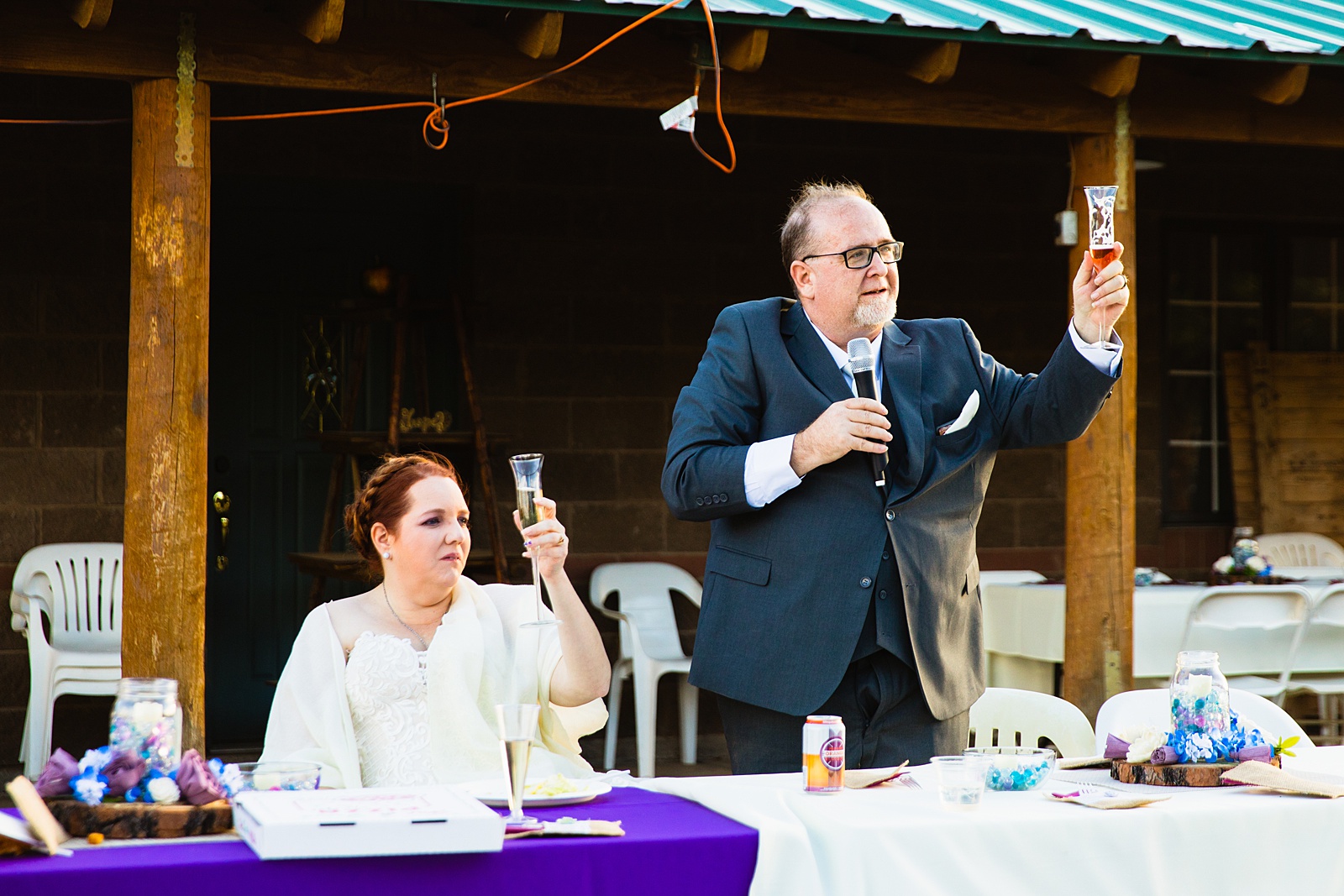 Wedding toasts at 101 Polo Club wedding reception by Tempe wedding photographer PMA Photography.
