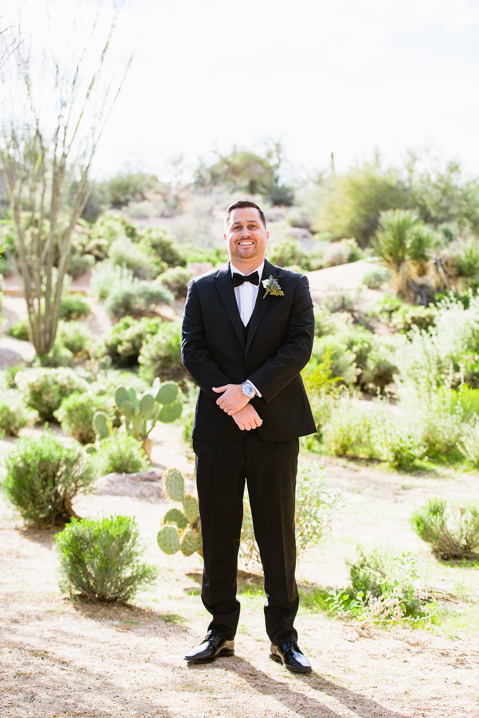 Groom's black tux with bowtie for his Troon North wedding by PMA Photography.