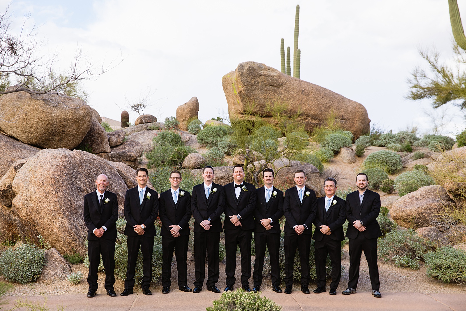 Groom and groomsmen together at a Troon North wedding by Arizona wedding photographer PMA Photography.