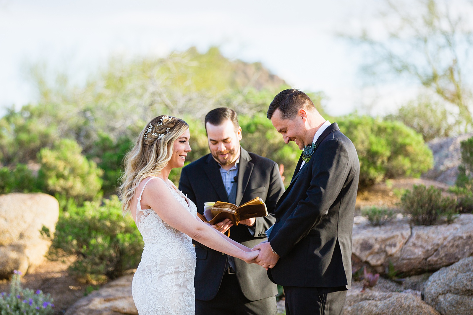 Bride and groom together during Troon North wedding ceremony by Scottsdale wedding photographer PMA Photography.