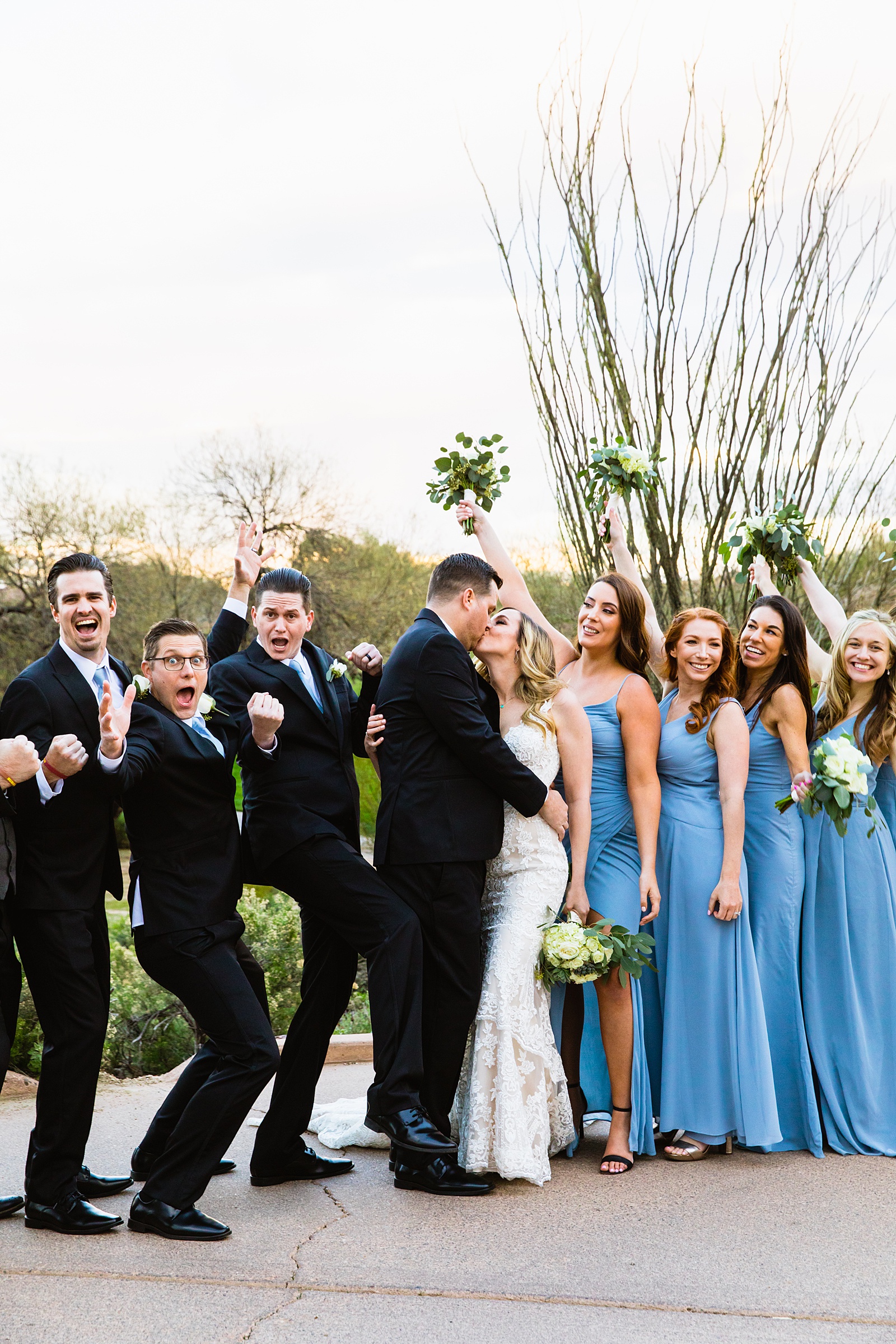 Bridal party having fun together at Troon North weding by Arizona wedding photographer PMA Photography.