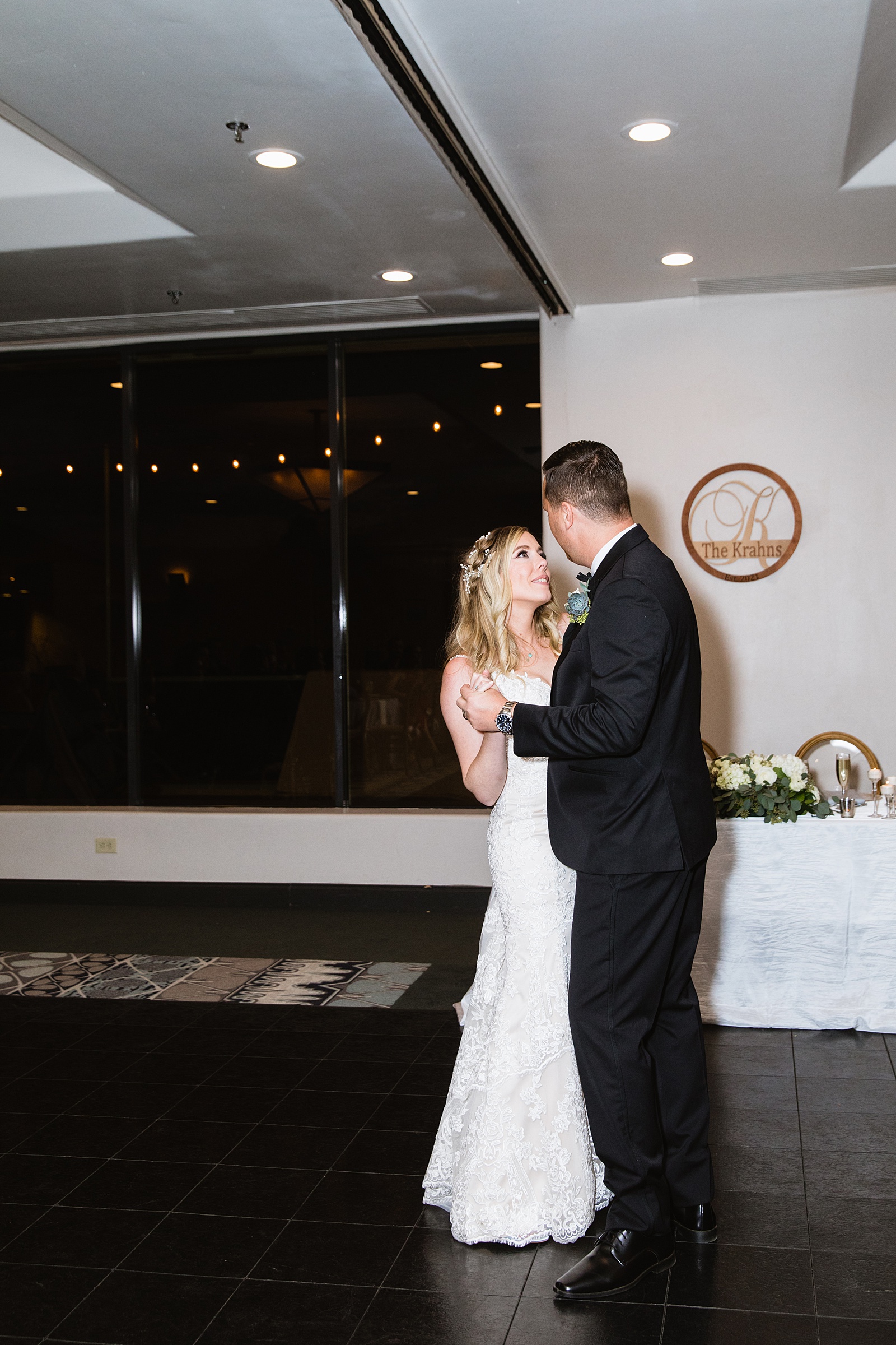 Newlyweds sharing first dance at their Troon North wedding reception by Arizona wedding photographer PMA Photography.