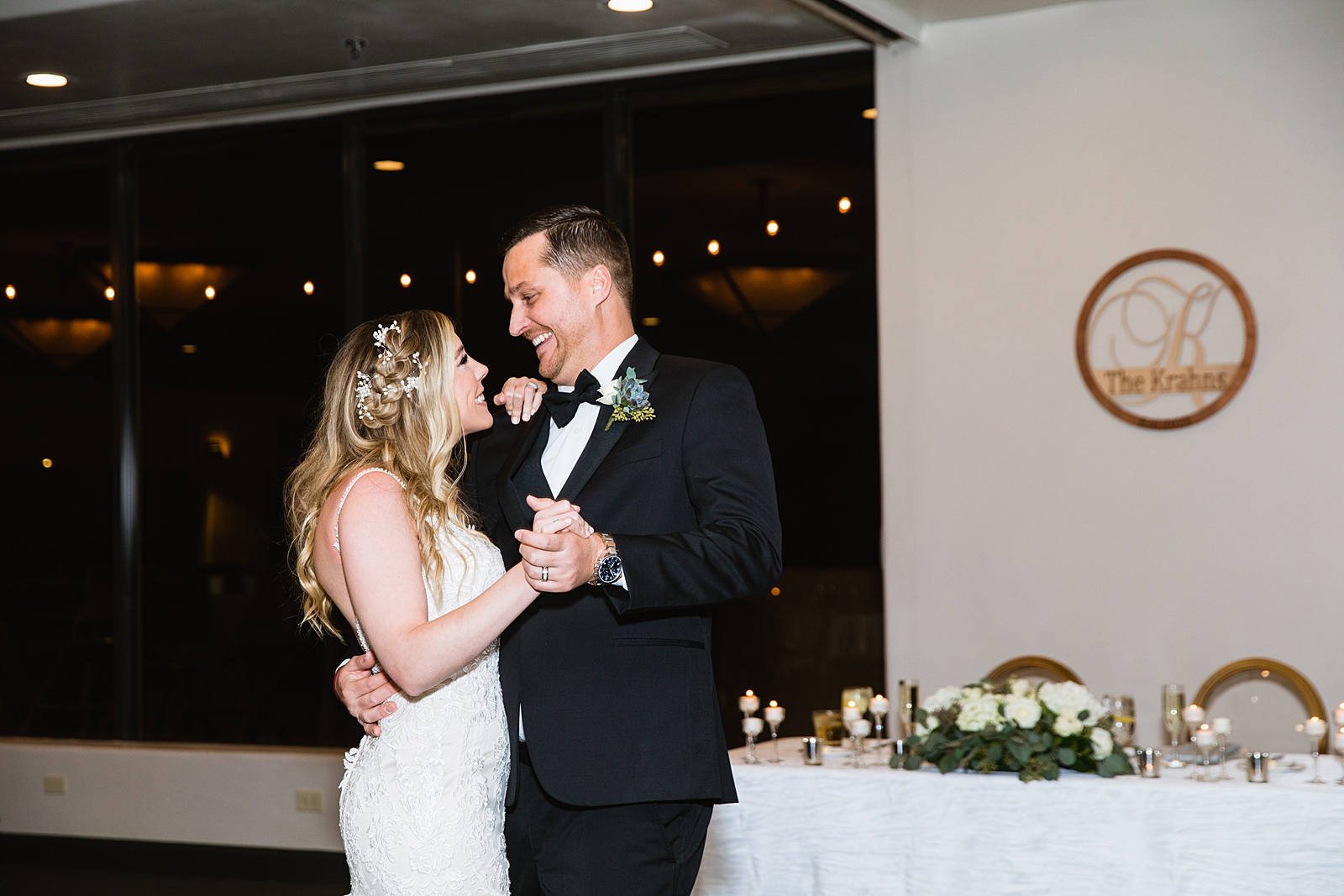 Newlyweds sharing first dance at their Troon North wedding reception by Arizona wedding photographer PMA Photography.