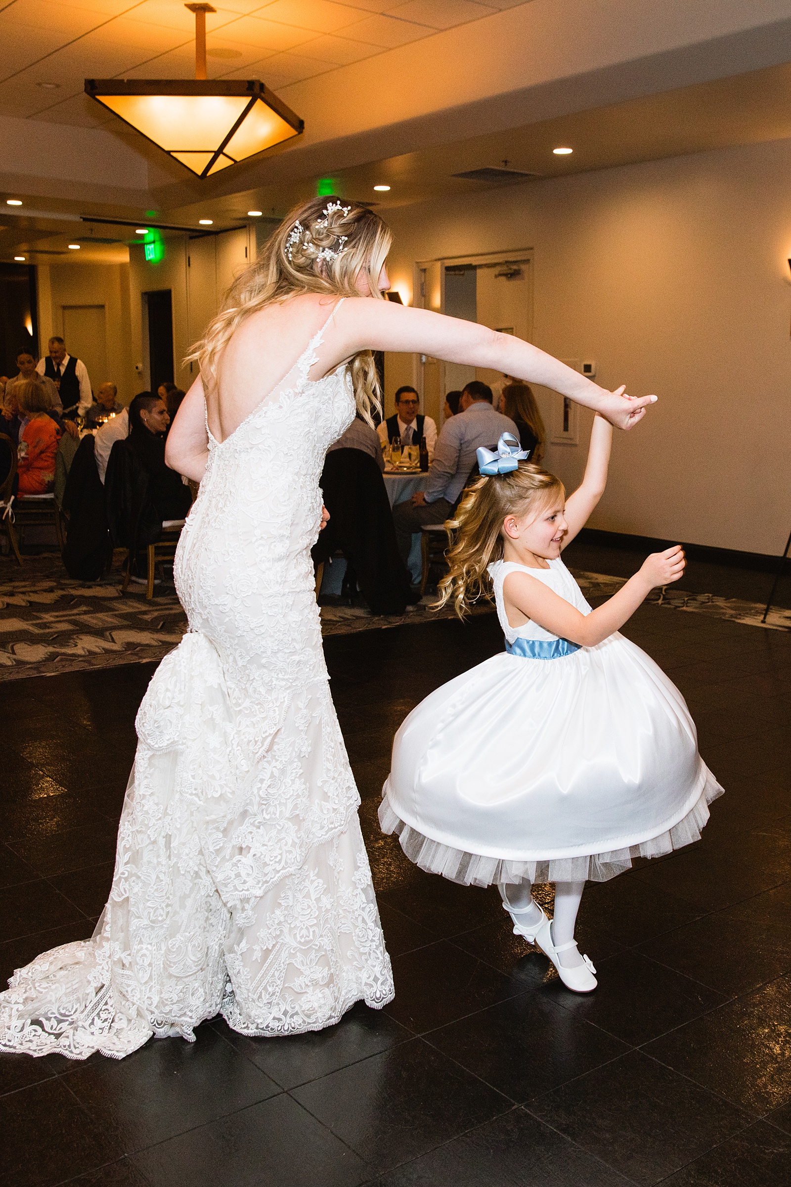 Bride dancing with guests at Troon North wedding reception by Scottsdale wedding photographer PMA Photography