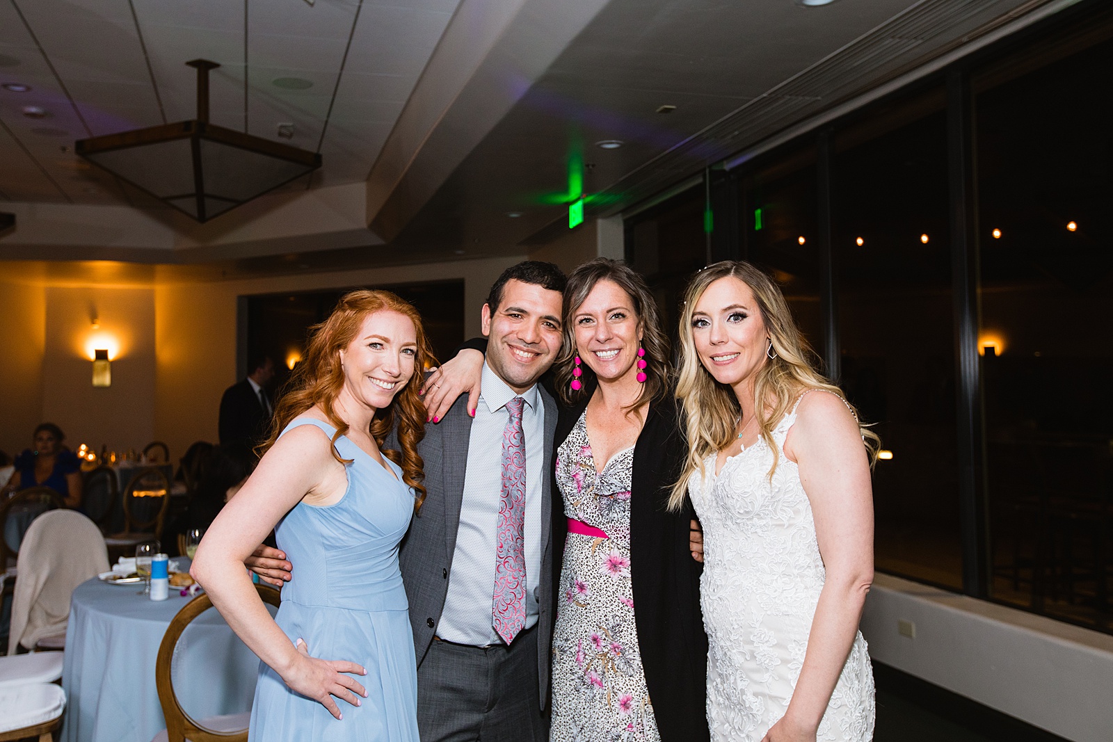 Bride with guests at Troon North wedding reception by Scottsdale wedding photographer PMA Photography