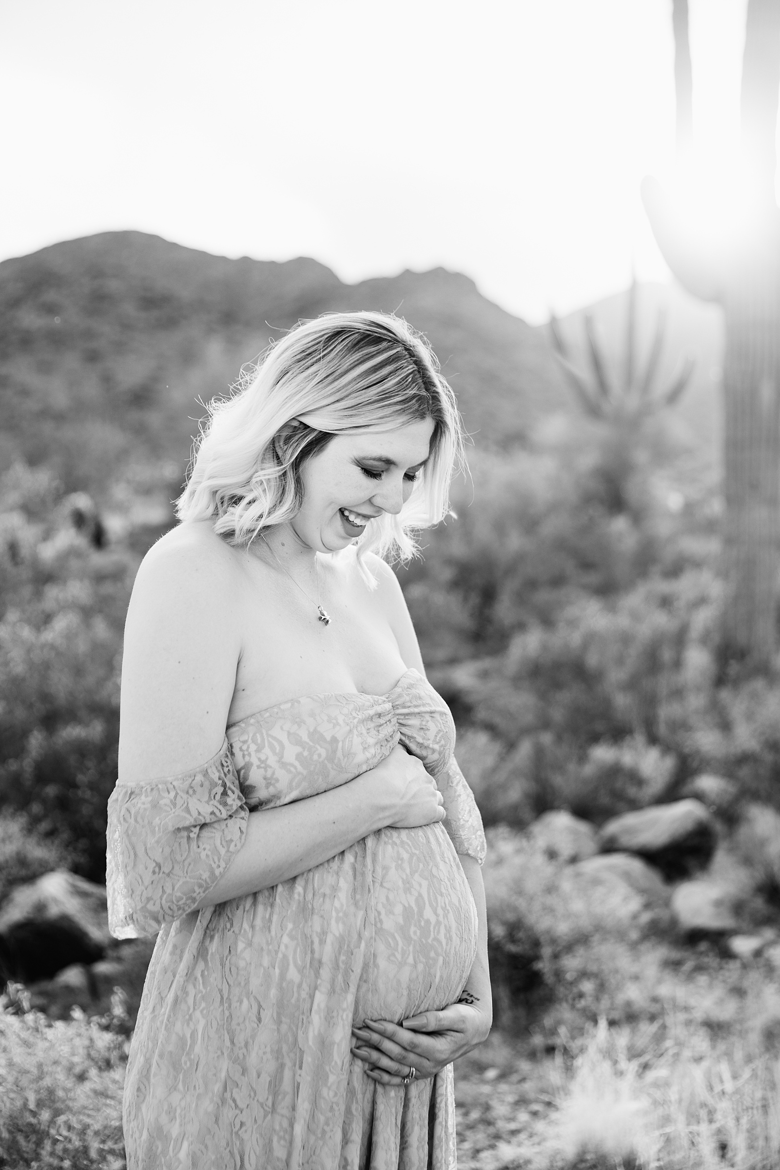 Pregnant mother poses for her White Tanks Desert maternity session by Phoenix maternity photographer PMA Photography.