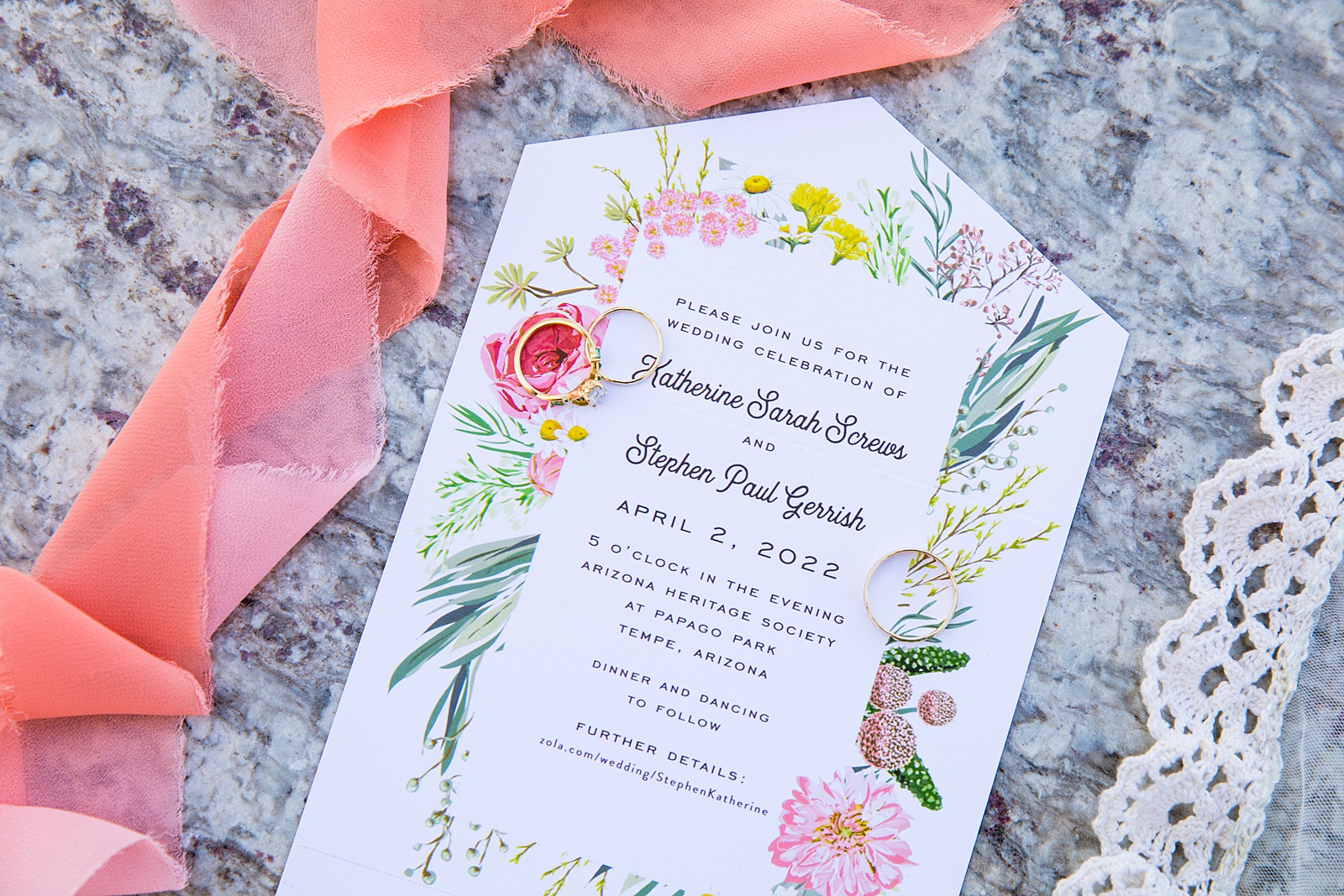 Brides's wedding day details of invitation and rings by PMA Photography.