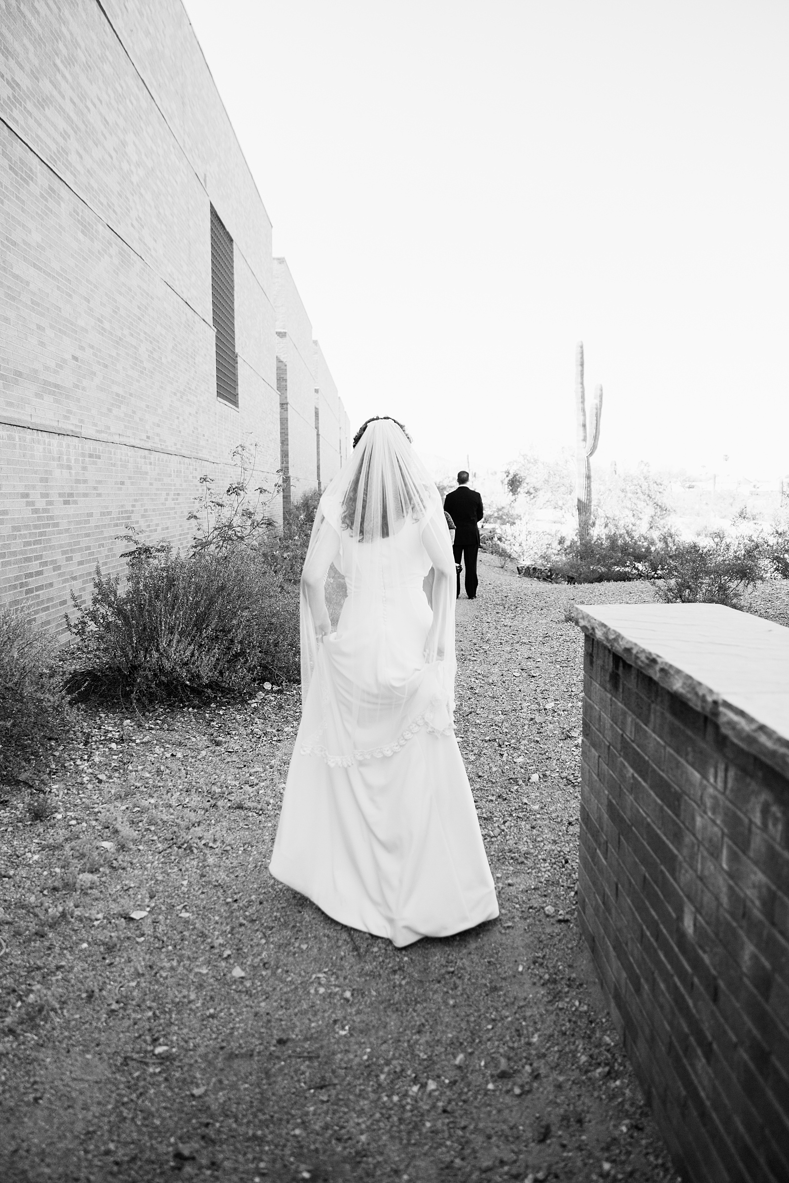 Bride and groom's first look at Arizona Historical Society by Phoenix wedding photographer PMA Photography.