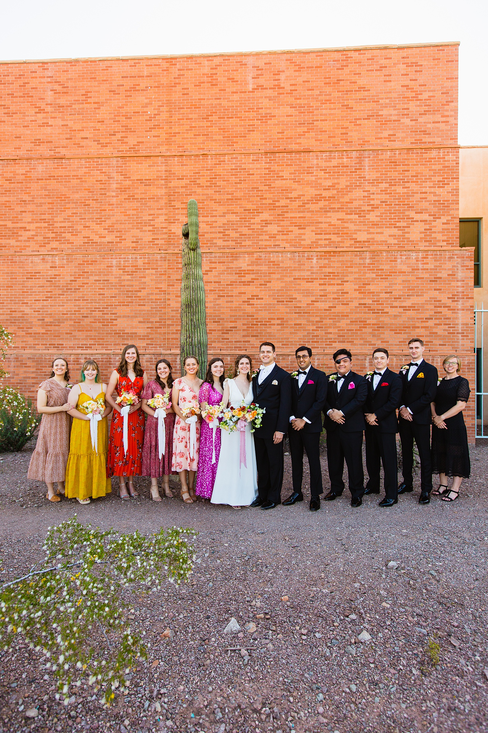 Mixed gender bridal party together at a Arizona Historical Society wedding by Arizona wedding photographer PMA Photography.
