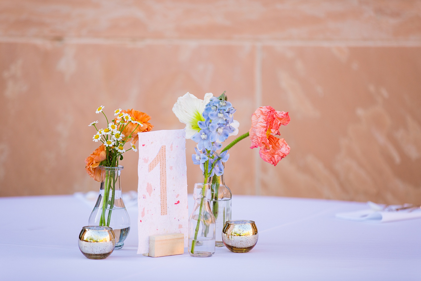 Eclectic and handmade reception decorations at Arizona Historical Society wedding reception by Tempe wedding photographer PMA Photography.