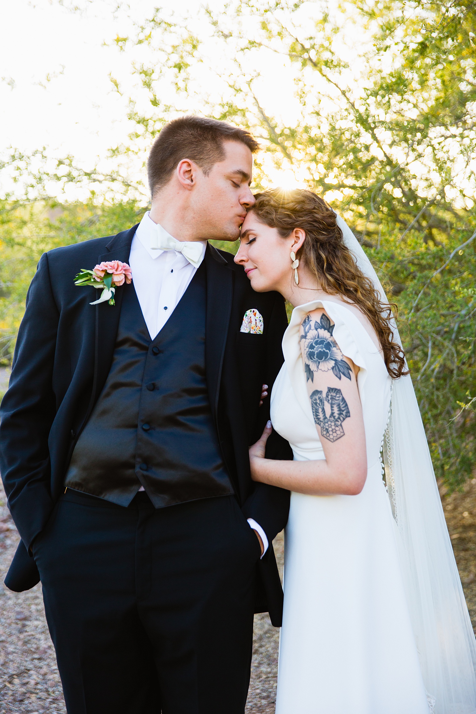 Bride and groom share an intimate moment during their Arizona Historical Society wedding by Tempe wedding photographer PMA Photography.