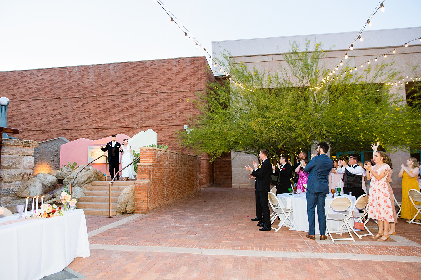 Couple's grand entrance at Arizona Historical Society wedding reception by Tempe wedding photographer PMA Photography.