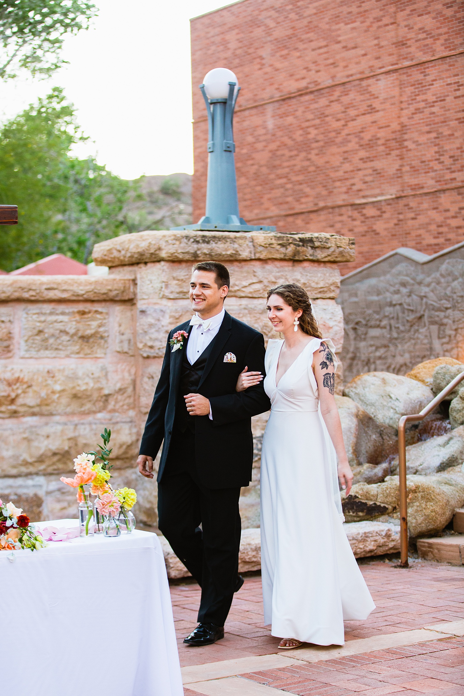 Couple's grand entrance at Arizona Historical Society wedding reception by Tempe wedding photographer PMA Photography.