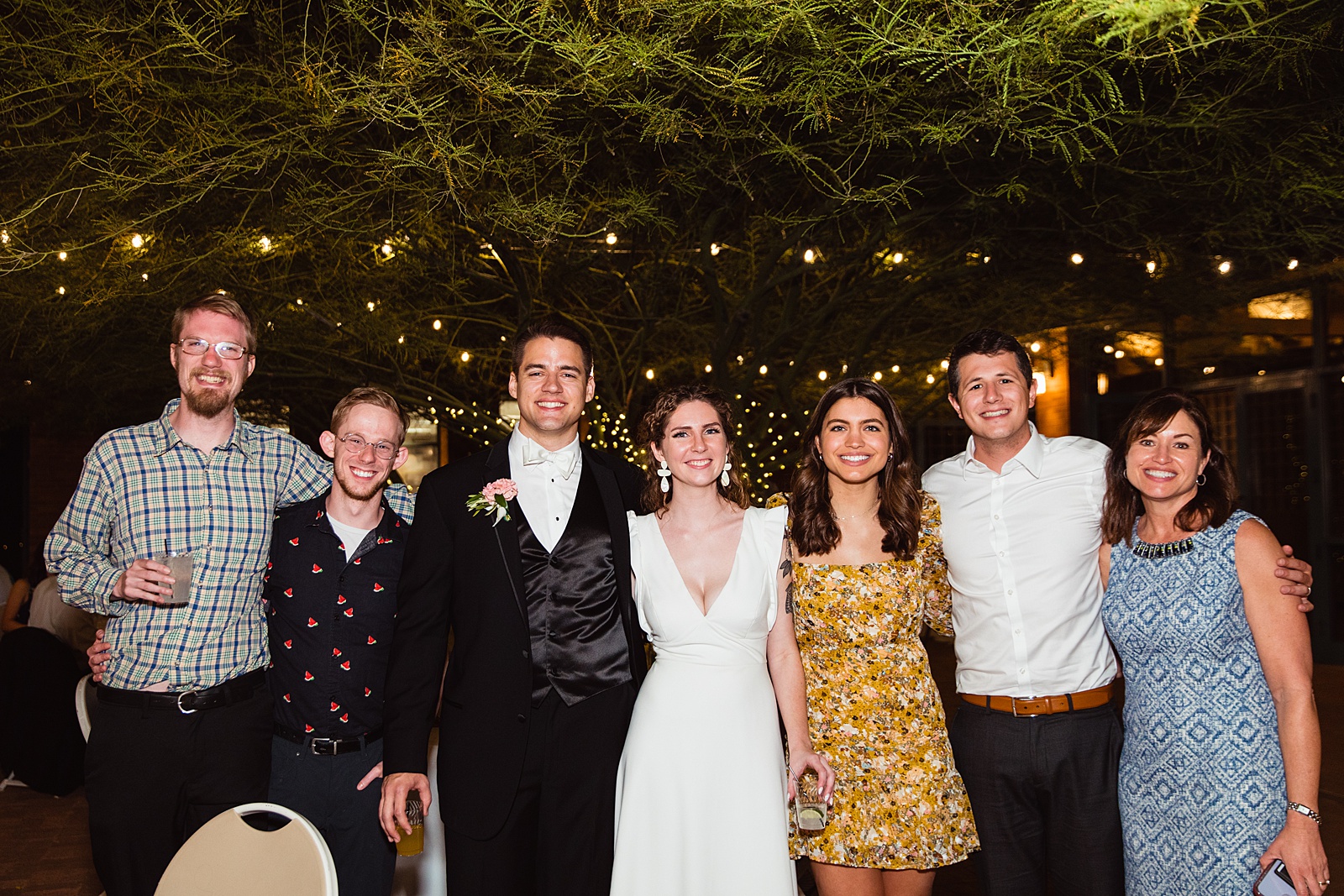Bride and groom with guests at Arizona Historical Society wedding reception by Tempe wedding photographer PMA Photography