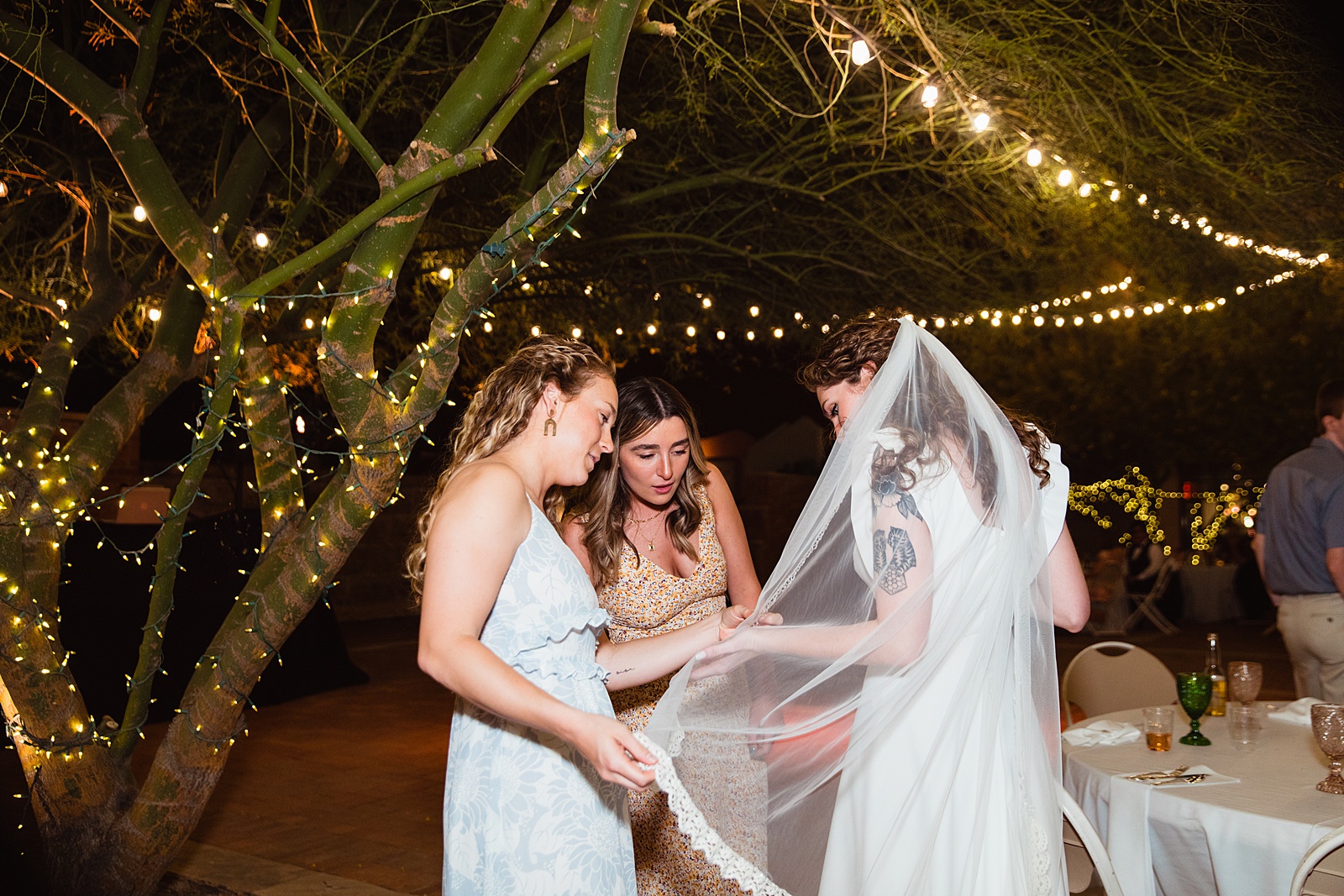 Bride with guests at Arizona Historical Society wedding reception by Tempe wedding photographer PMA Photography