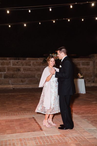 Groom dancing with his mom at Arizona Historical Society wedding reception by Tempe wedding photographer PMA Photography