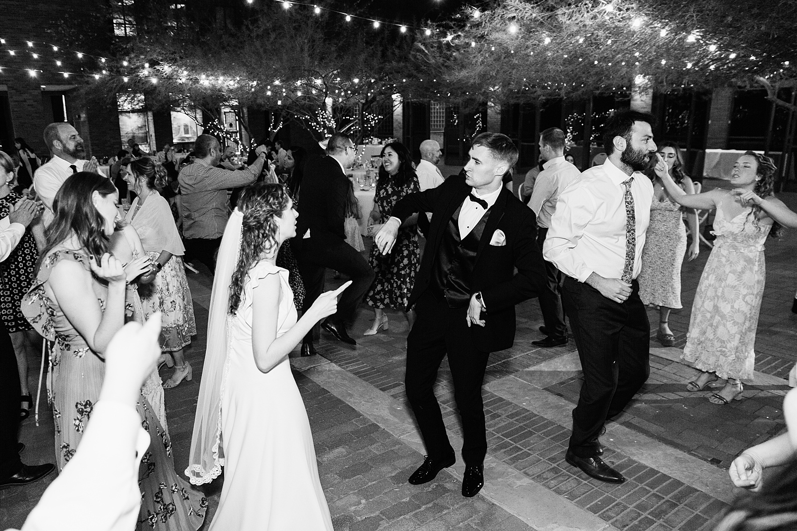 Bride dancing with guests at Arizona Historical Society wedding reception by Tempe wedding photographer PMA Photography