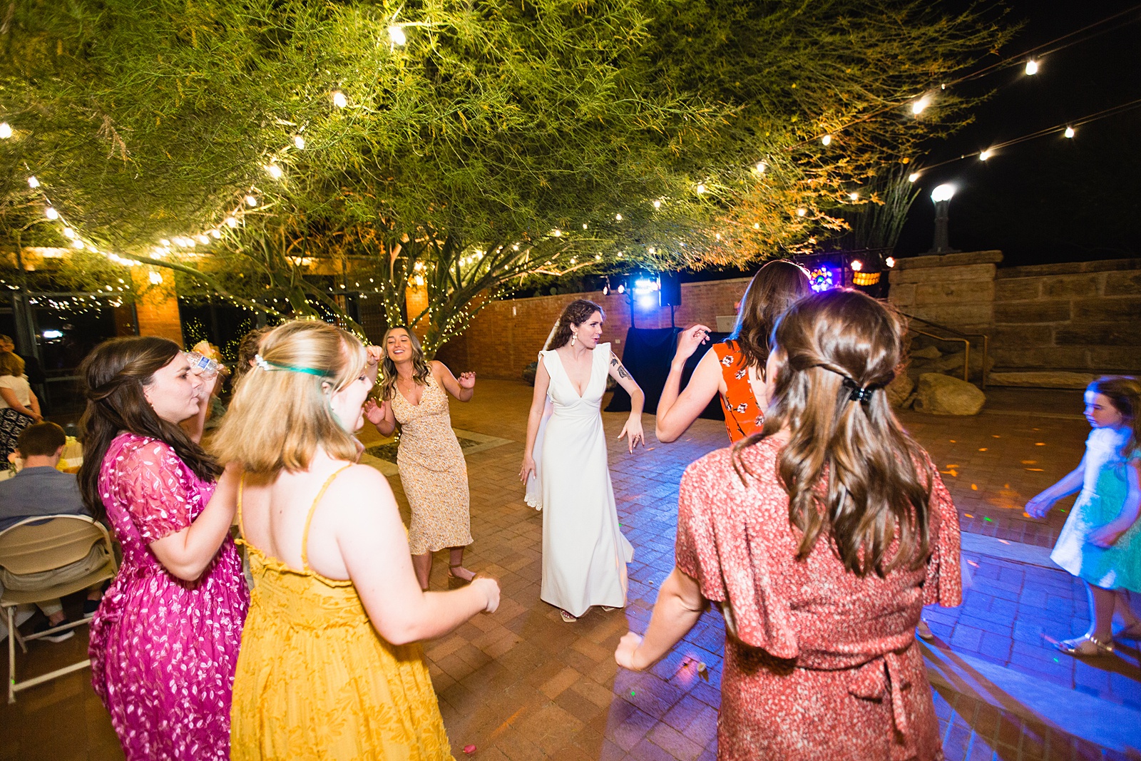 Bride dancing with guests at Arizona Historical Society wedding reception by Tempe wedding photographer PMA Photography
