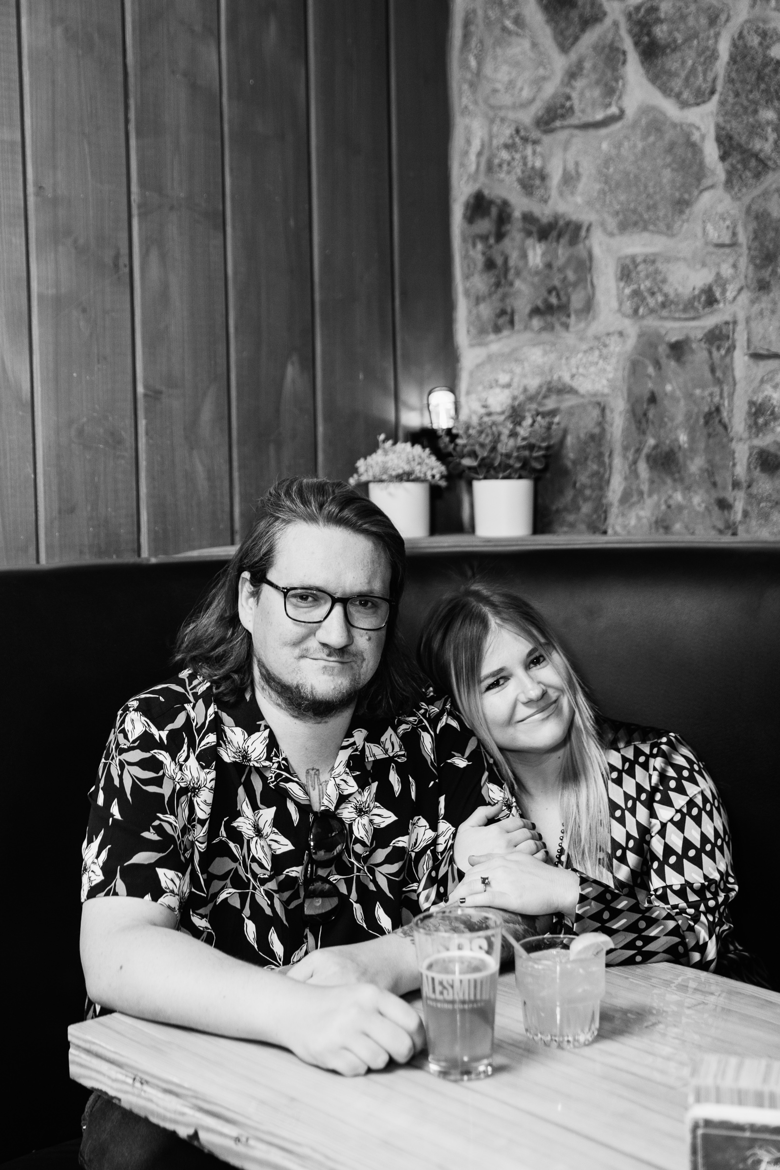 Couple pose for their Thunderbird Lounge engagement session by Phoenix wedding photographer PMA Photography.