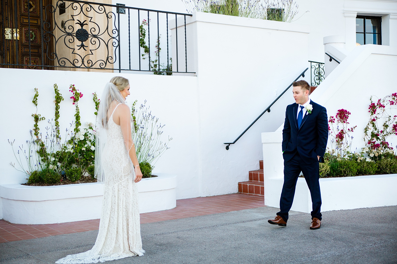 Bride and Groom's first look at Wrigley Mansion by Phoenix wedding photographer PMA Photography.