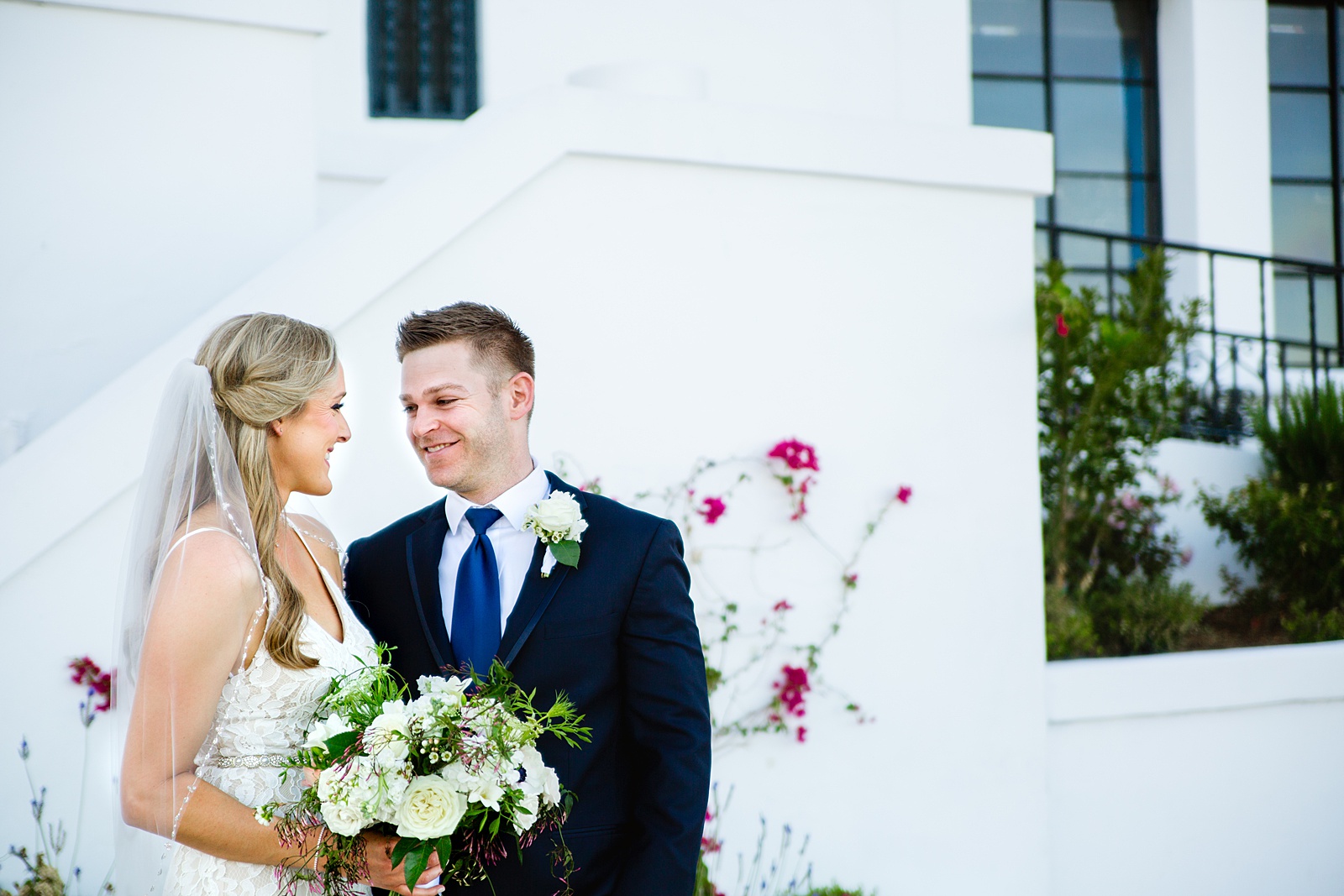 Bride and Groom pose for their Wrigley Mansion wedding by Phoenix wedding photographer PMA Photography.