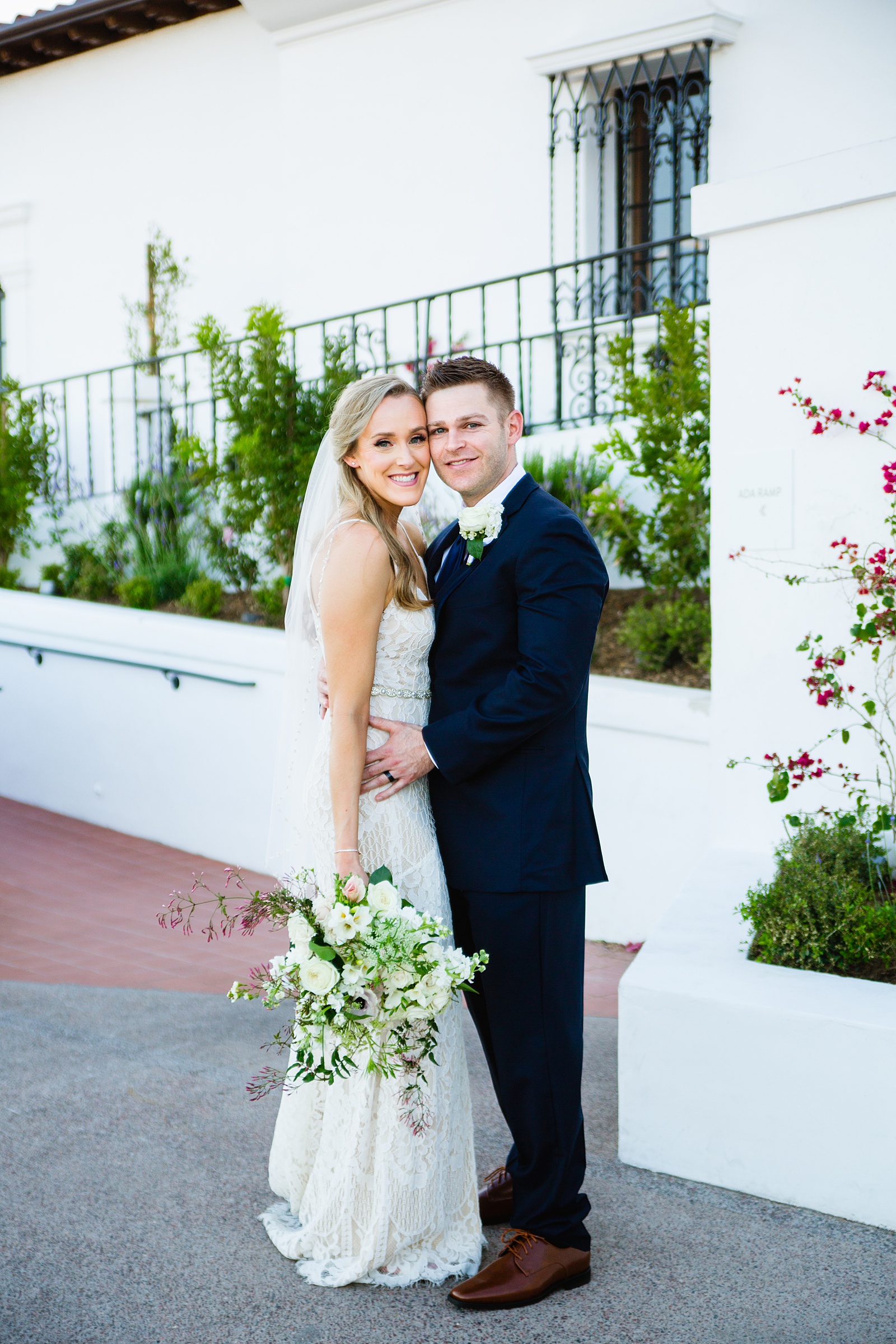 Bride and Groom pose during their Wrigley Mansion wedding by Arizona wedding photographer PMA Photography.