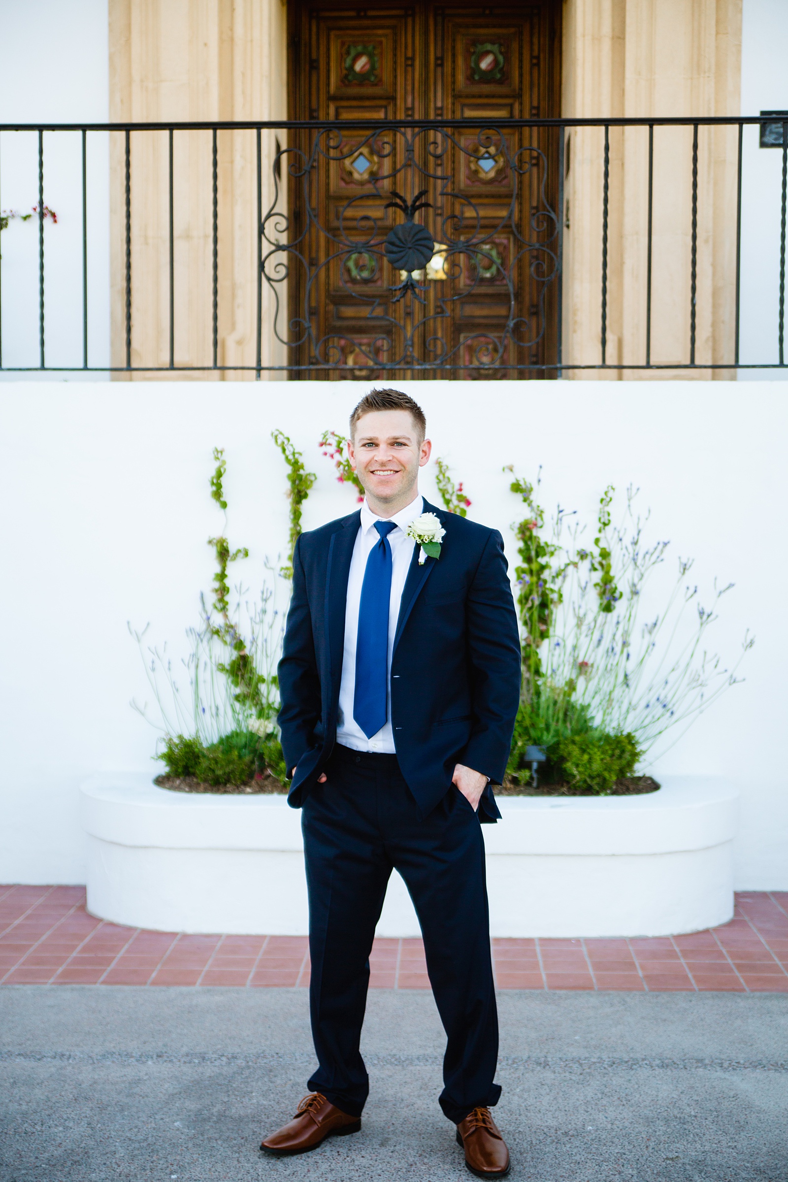 Groom's navy suit for his Wrigley Mansion wedding by PMA Photography.