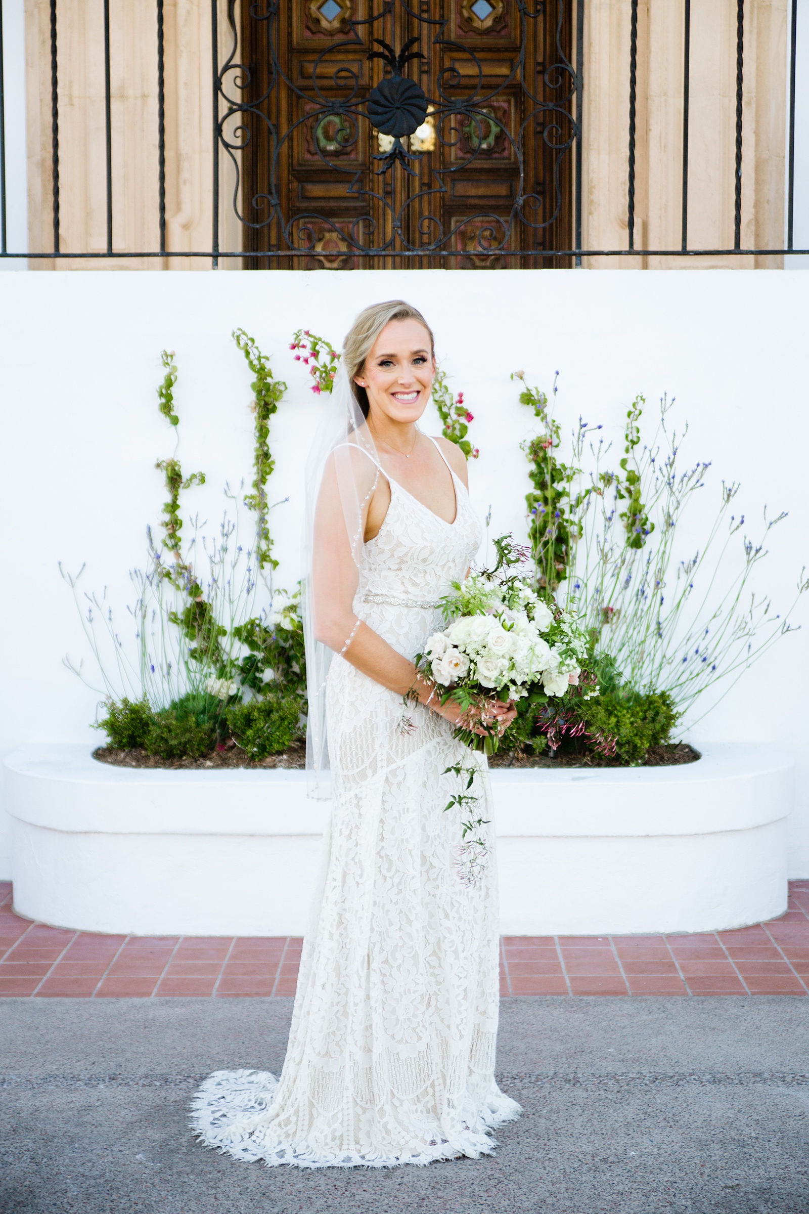 Bride's romantic lace wedding dress for her Wrigley Mansion wedding by PMA Photography.