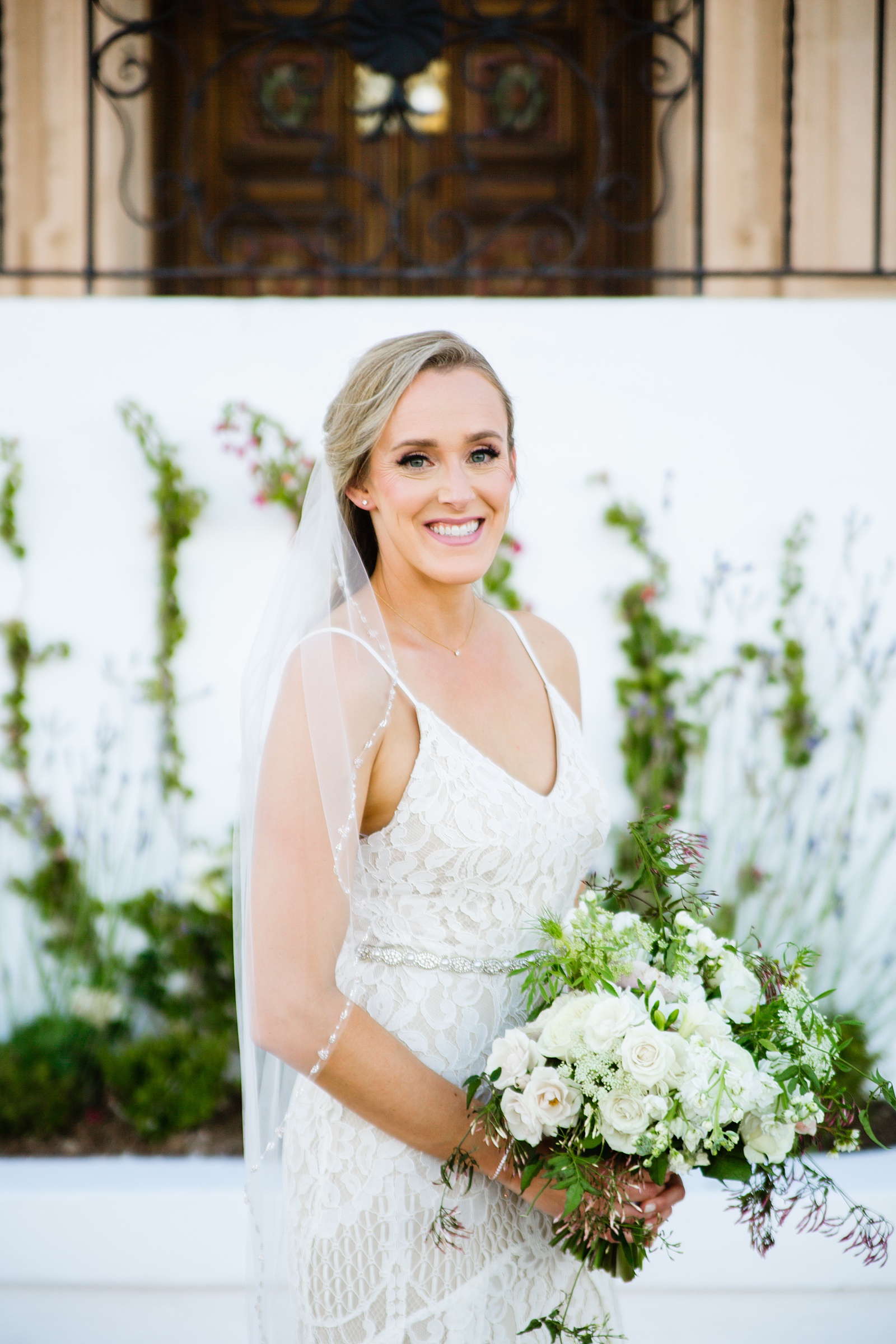 Bride's romantic lace wedding dress for her Wrigley Mansion wedding by PMA Photography.