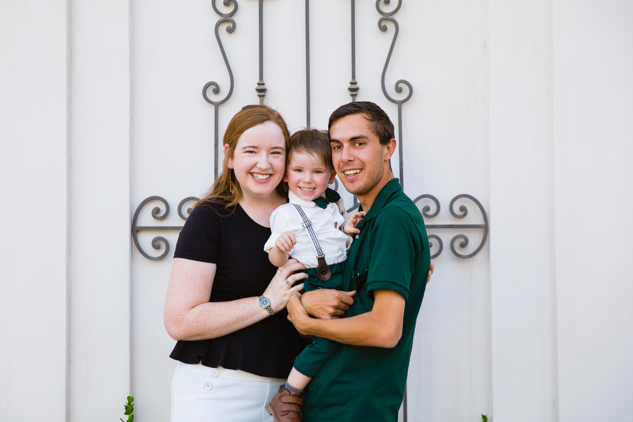 Family pose for their downtown family session by Verrado family photographer PMA Photography.