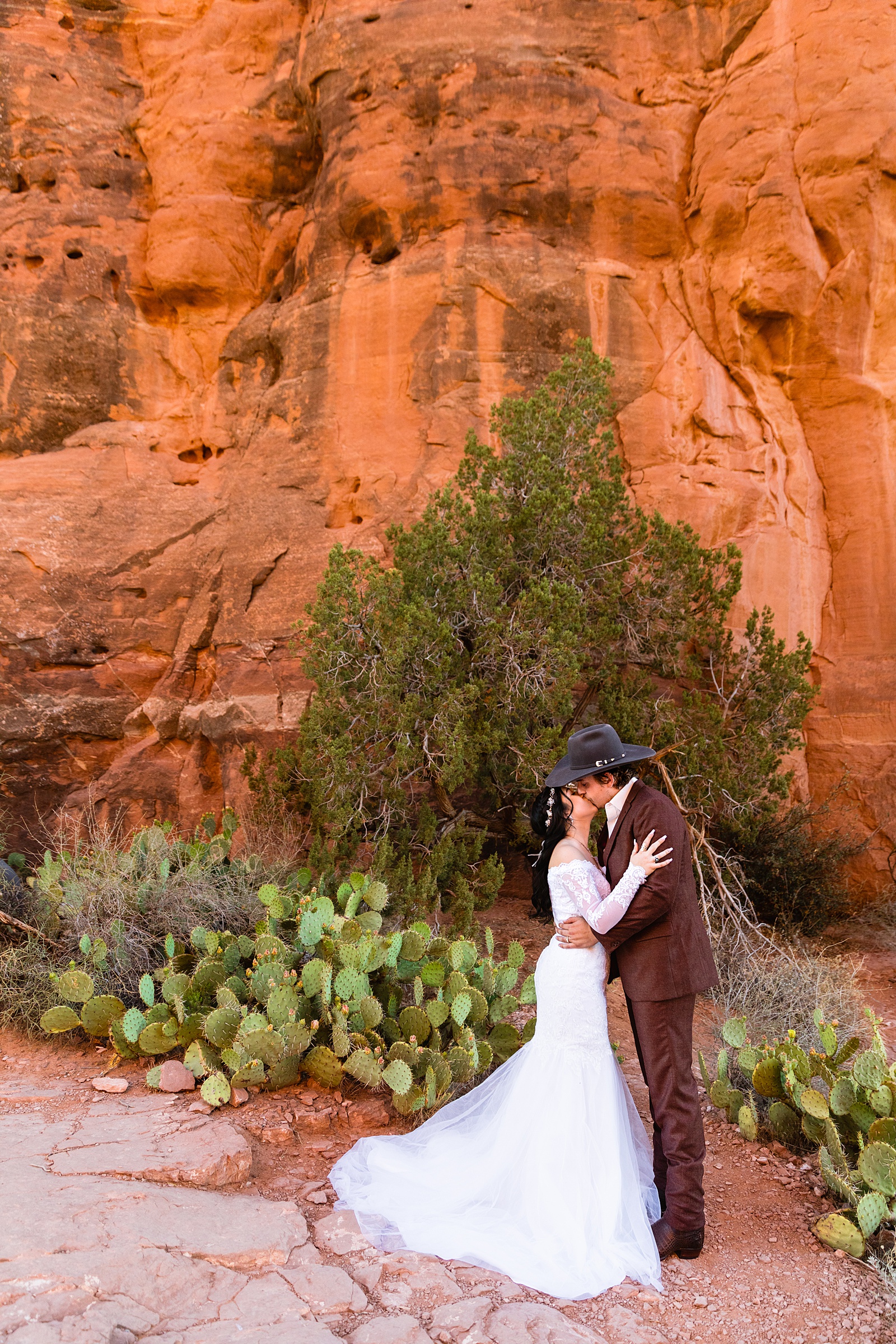 Bride and Groom share a kiss during their Cathedral Rock elopement by Arizona elopement photographer PMA Photography.