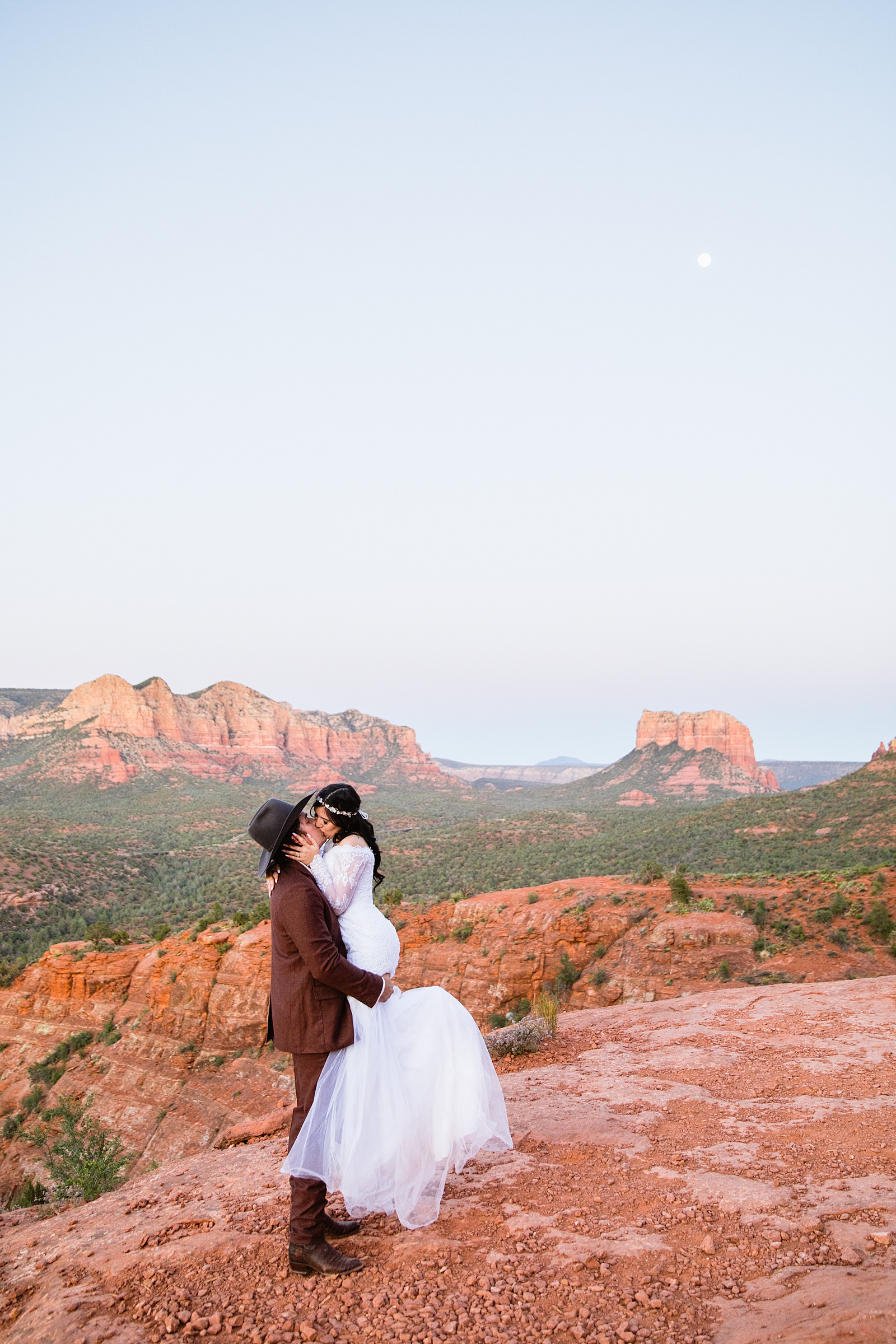 Bride and Groom share a kiss during their Cathedral Rock elopement by Arizona elopement photographer PMA Photography.