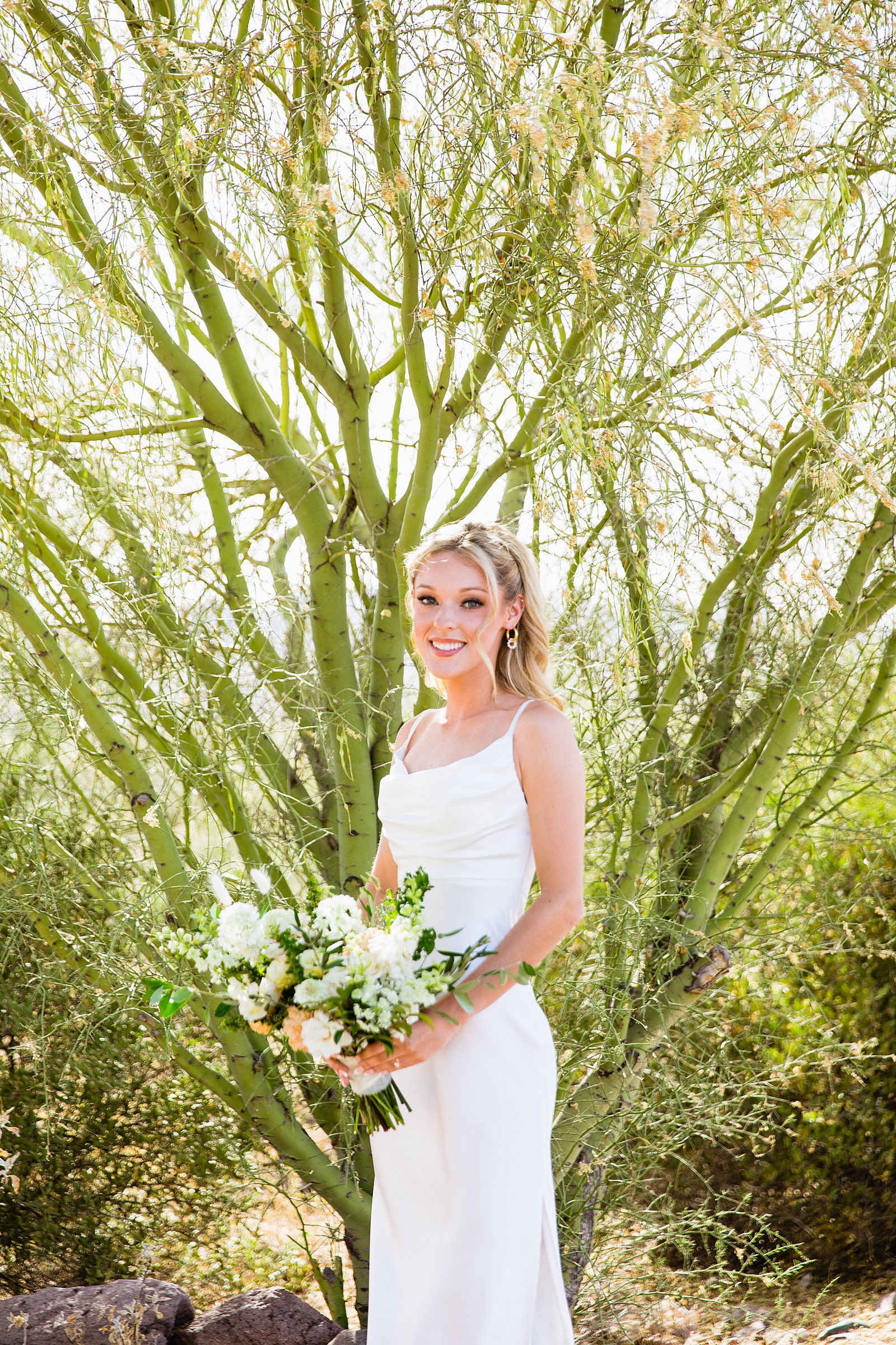 Bride's classic white sheath wedding dress for her Superstition Mountain Micro wedding by PMA Photography.