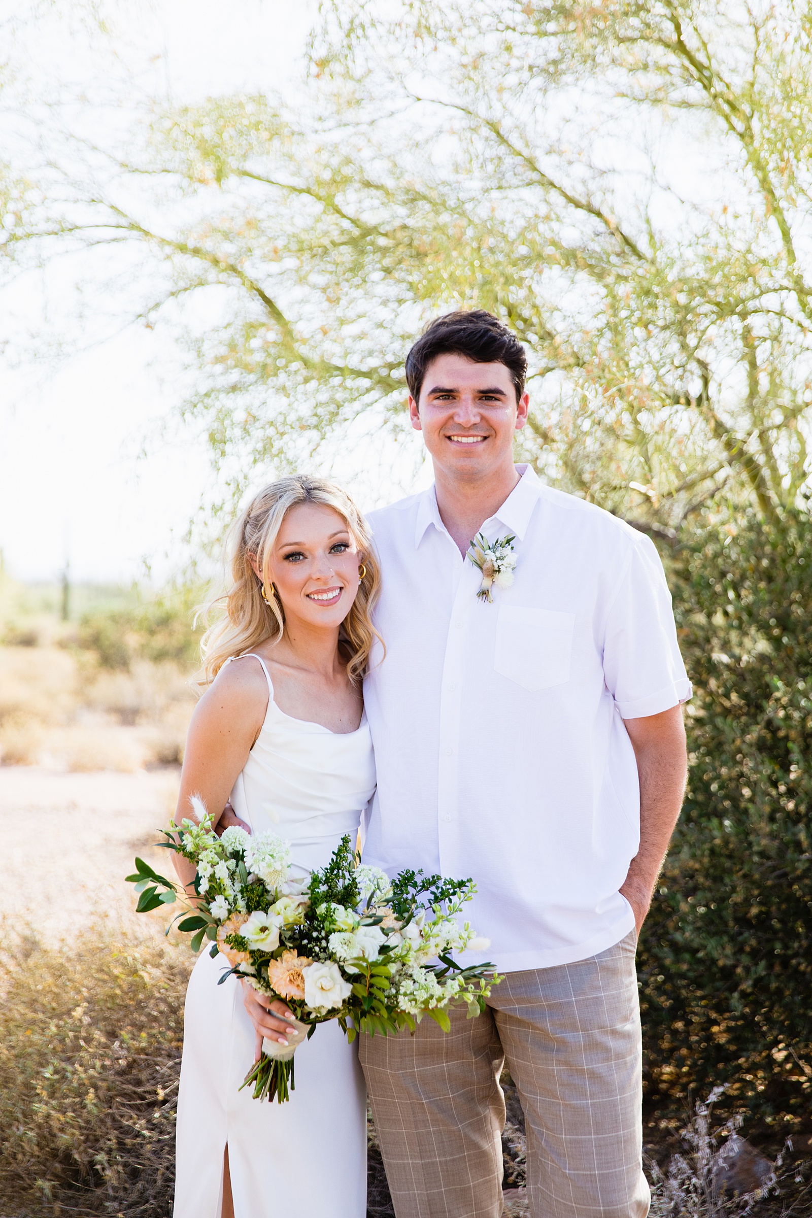 Bride and Groom pose during their Superstition Mountain Micro wedding by Arizona wedding photographer PMA Photography.