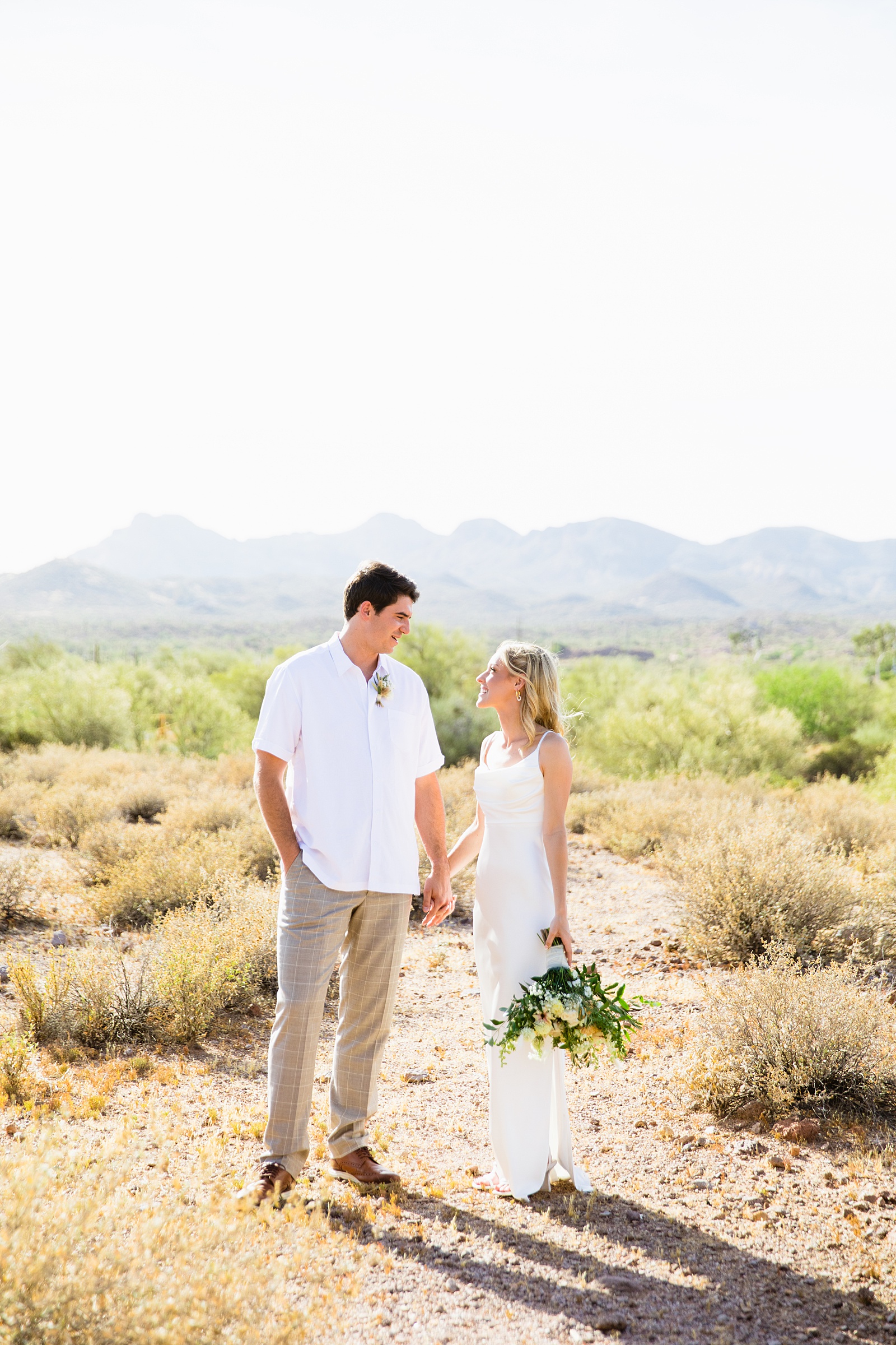 Bride and Groom pose for their Superstition Mountain Micro wedding by Lost Dutchman wedding photographer PMA Photography.