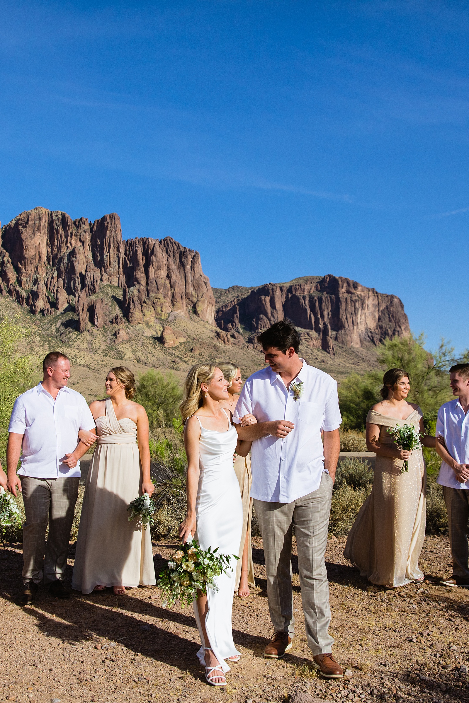 Bridal walking together at Superstition Mountain Micro weding by Arizona wedding photographer PMA Photography.